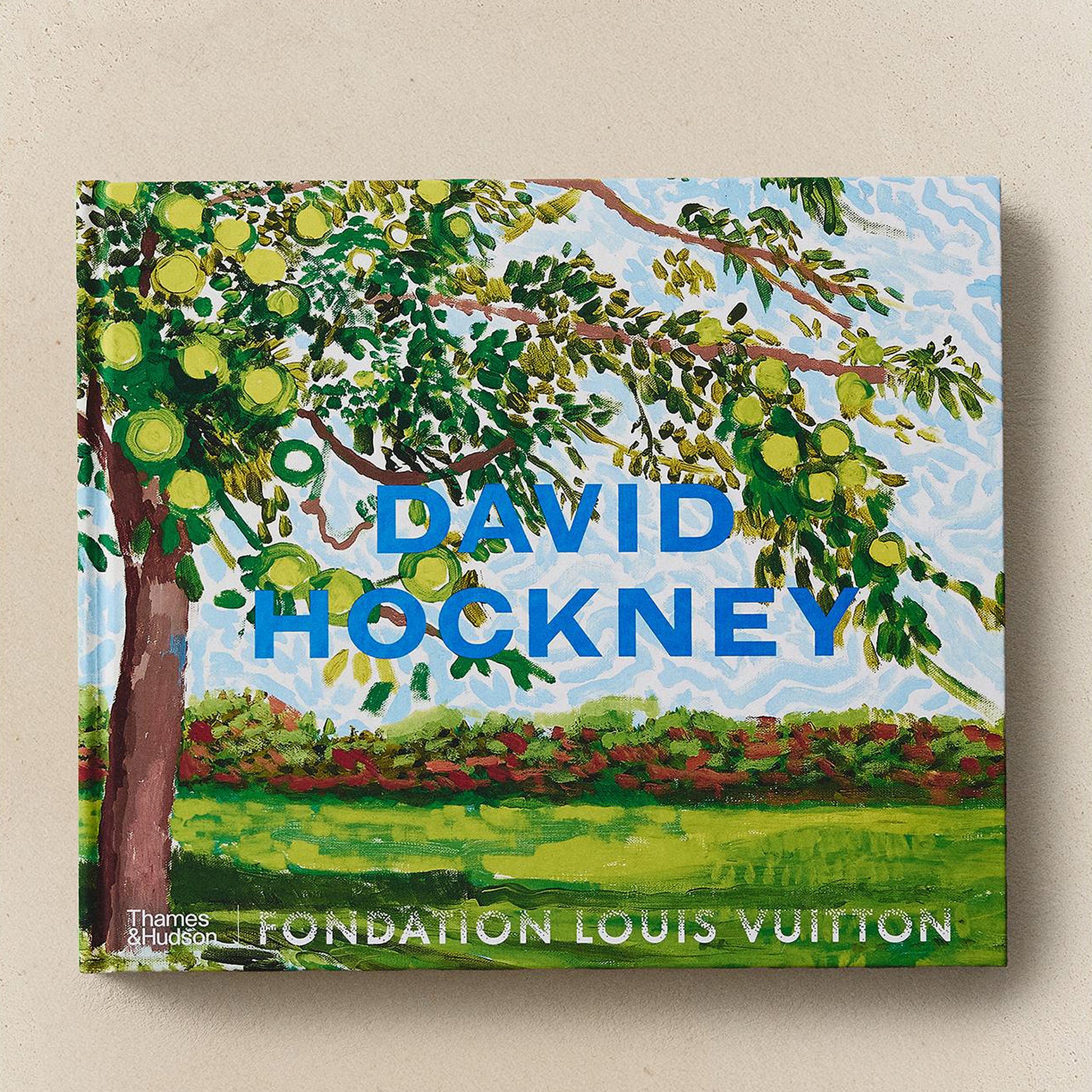 Book cover with a painting of a tree and 'David Hockney' text on a beige background
