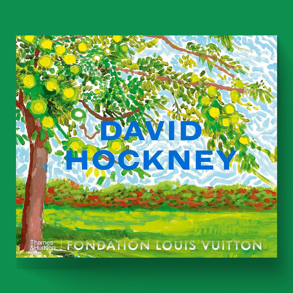 The front cover of the David Hockney coffee table book, published by Thames & Hudson in association with Fondation Louis Vuitton. The cover features a vivid landscape painting by the artist with "David Hockney" written prominently in blue.