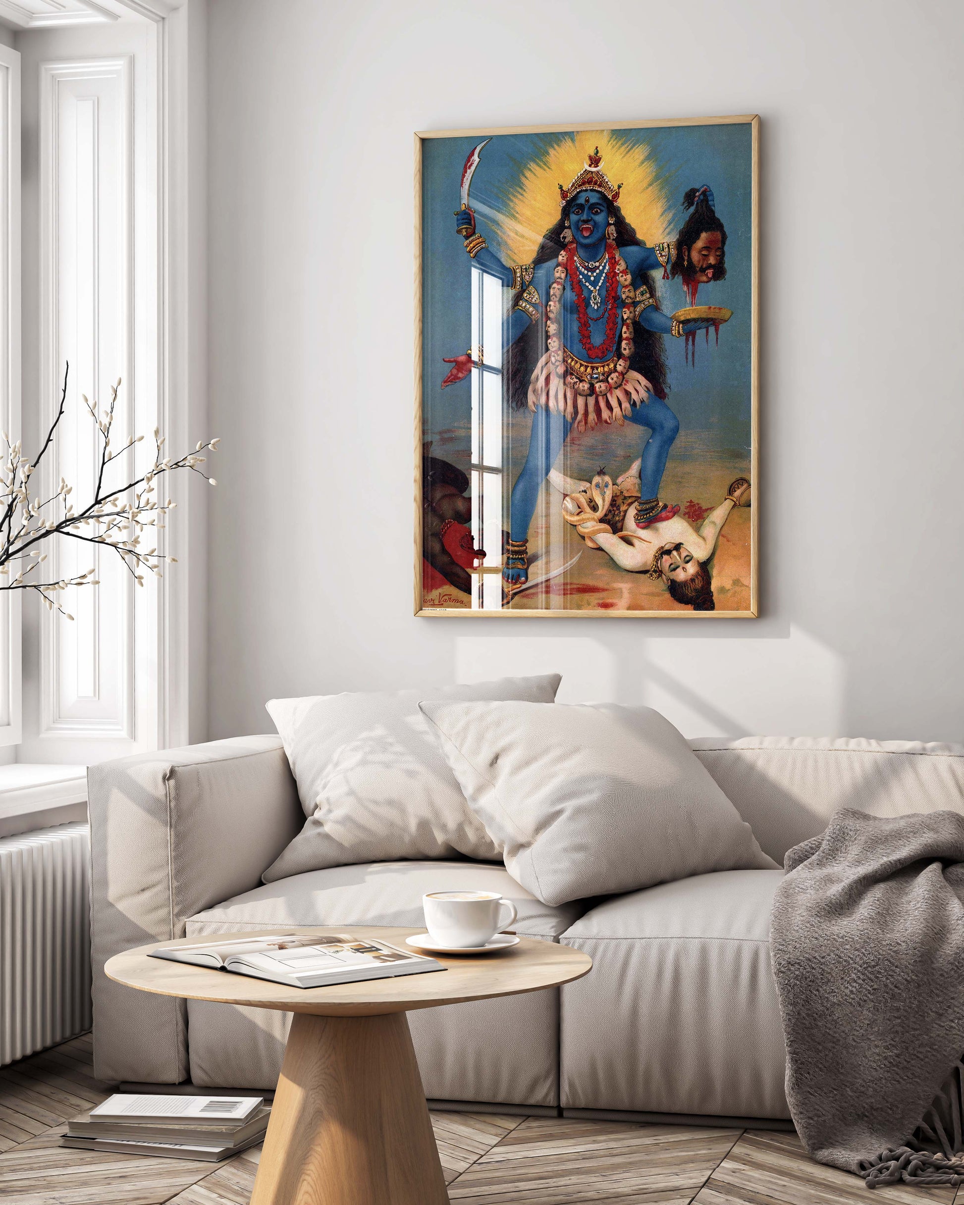 A beautiful Raja Ravi Varma Goddess Kali print, custom-framed and displayed as luxury wall art in a modern, high-end interior setting.