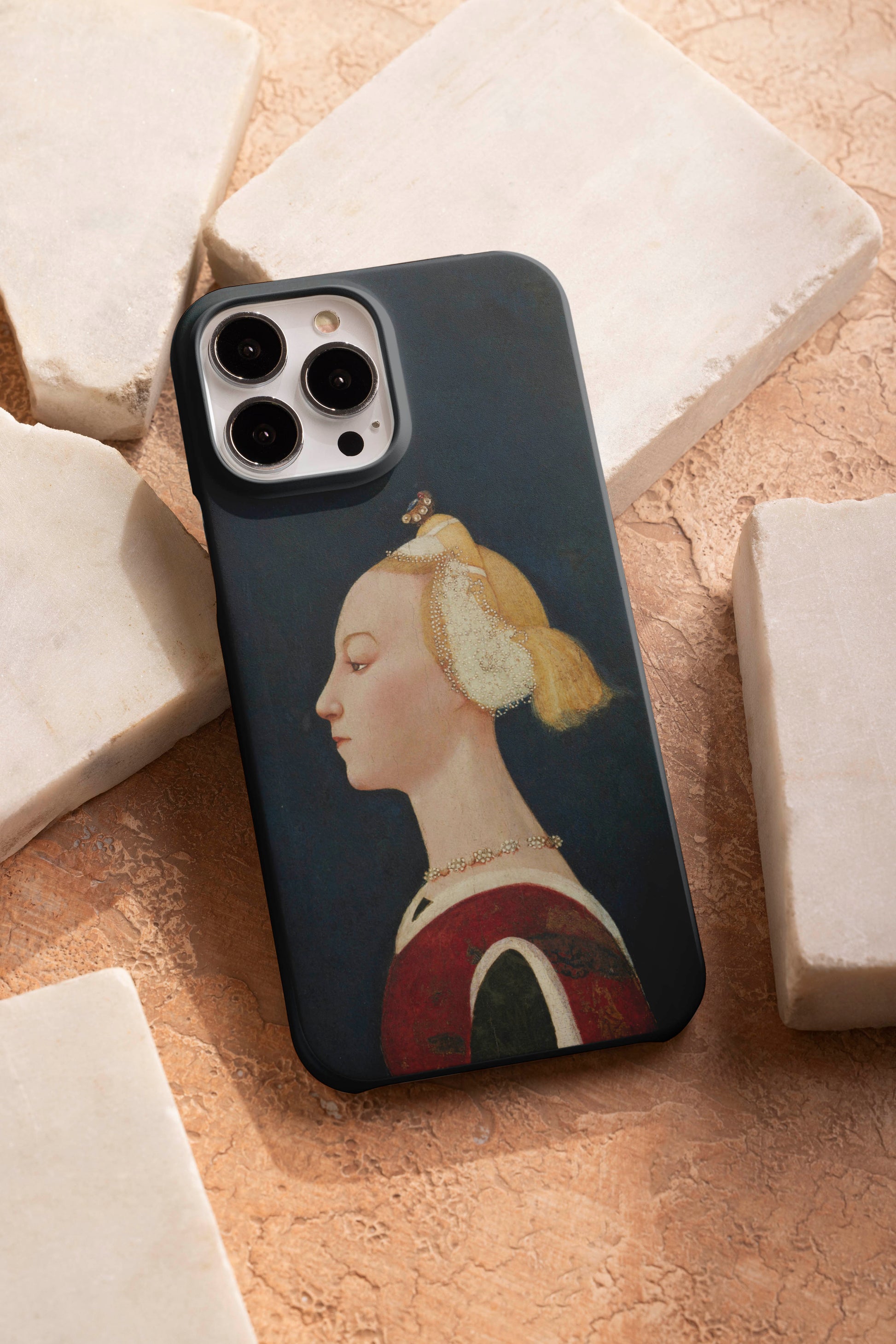 A tough dual-layer phone case by ART SNOB featuring a high-quality print of the "Portrait of a Woman" by the Master of the Castello Nativity. The phone case is displayed on a textured background with white marble blocks, highlighting the fine art accessory and its durable design.