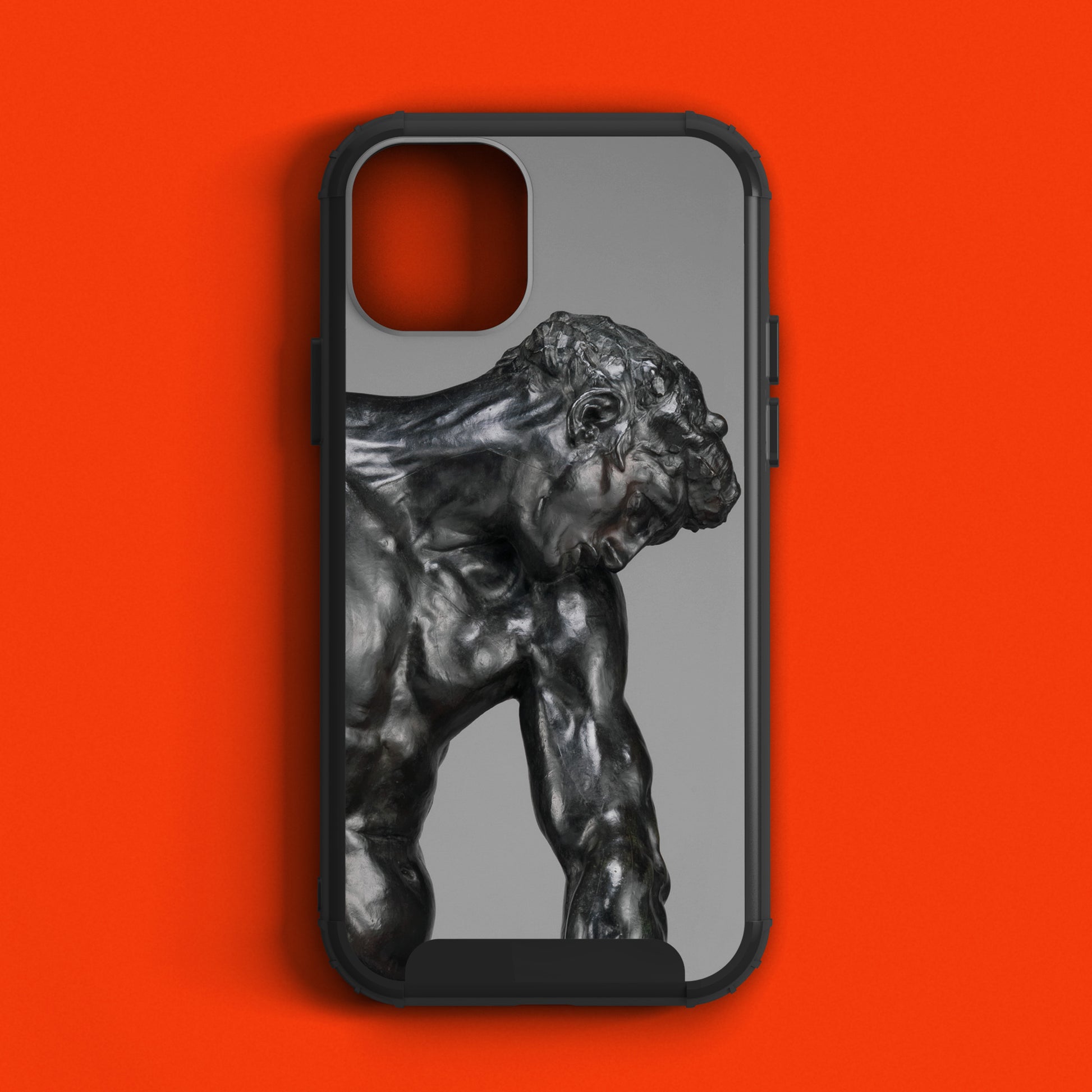 Close-up of the phone case surface highlighting the muscular contours of Rodin’s Adam sculpture in high-definition print.