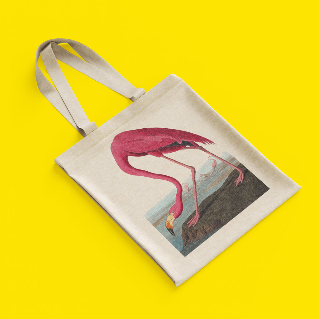 Close-up of reinforced stitching on cotton art tote bag handles, durable flamingo print shopping bag with quality construction details