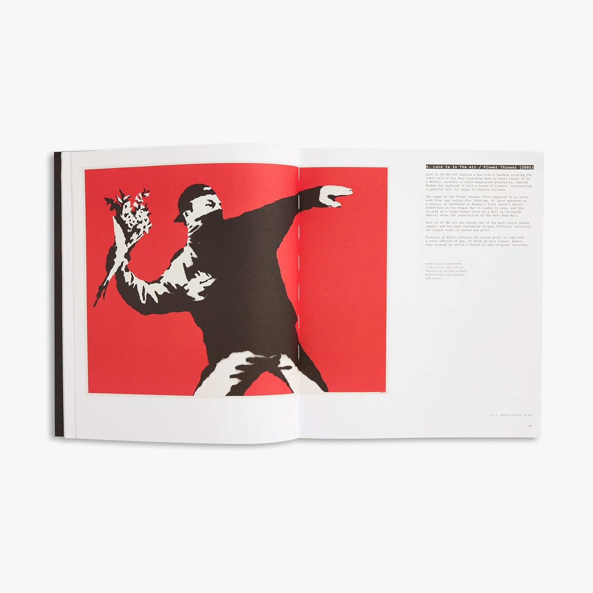 Interior spread from Banksy The Prints book showing Love Is In The Air Flower Thrower 2003 iconic artwork of masked figure throwing bouquet of flowers on red background