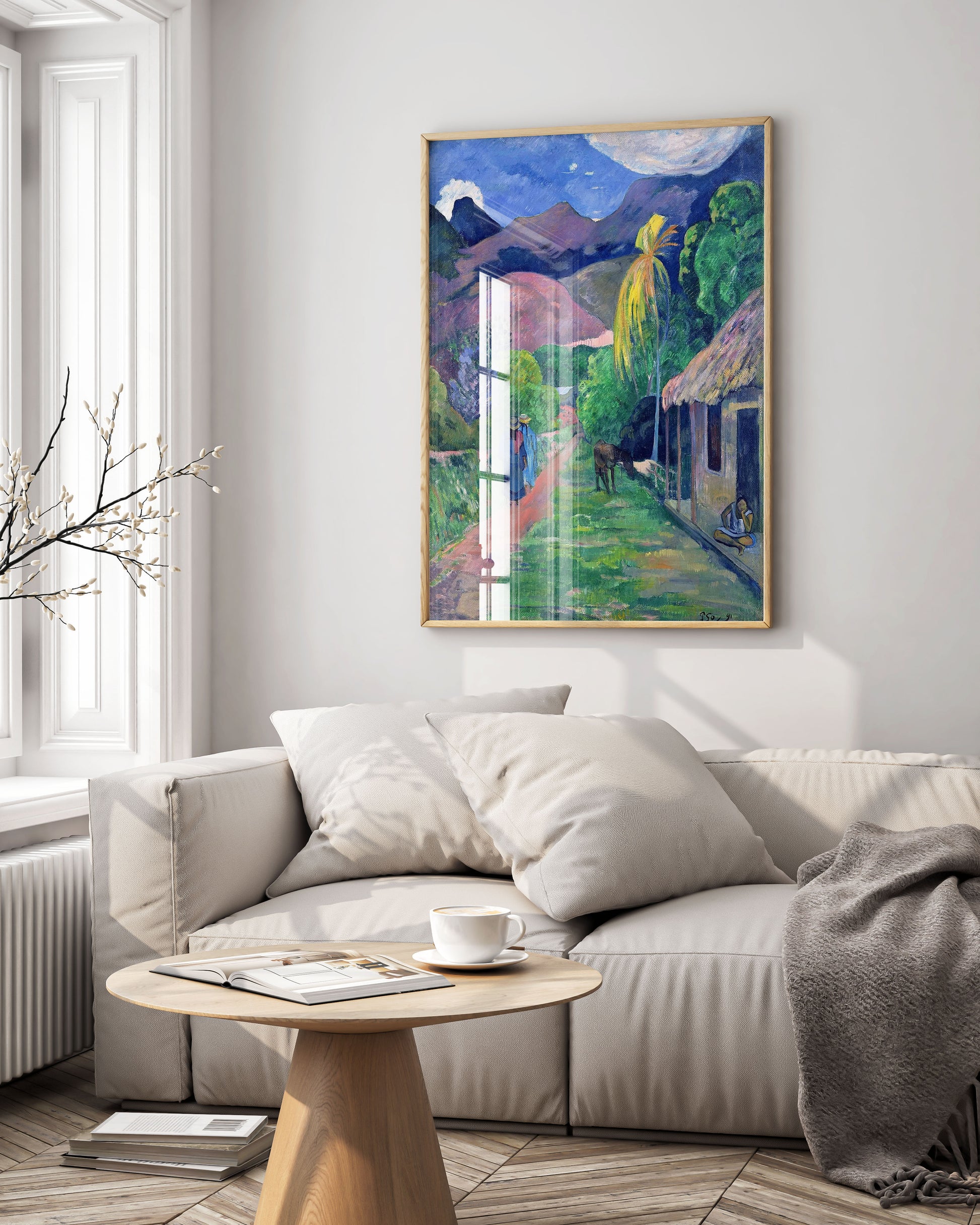 Paul Gauguin’s Street in Tahiti poster styled with indoor plants to create a biophilic, nature-inspired living room aesthetic.