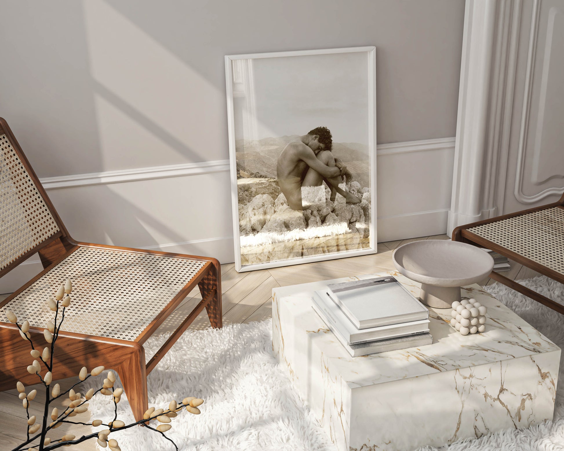 A close-up of a framed fine art print of Wilhelm von Gloeden's "Cain," a striking sepia-toned photograph, serving as a sophisticated centrepiece of a minimalist, luxury living room.
