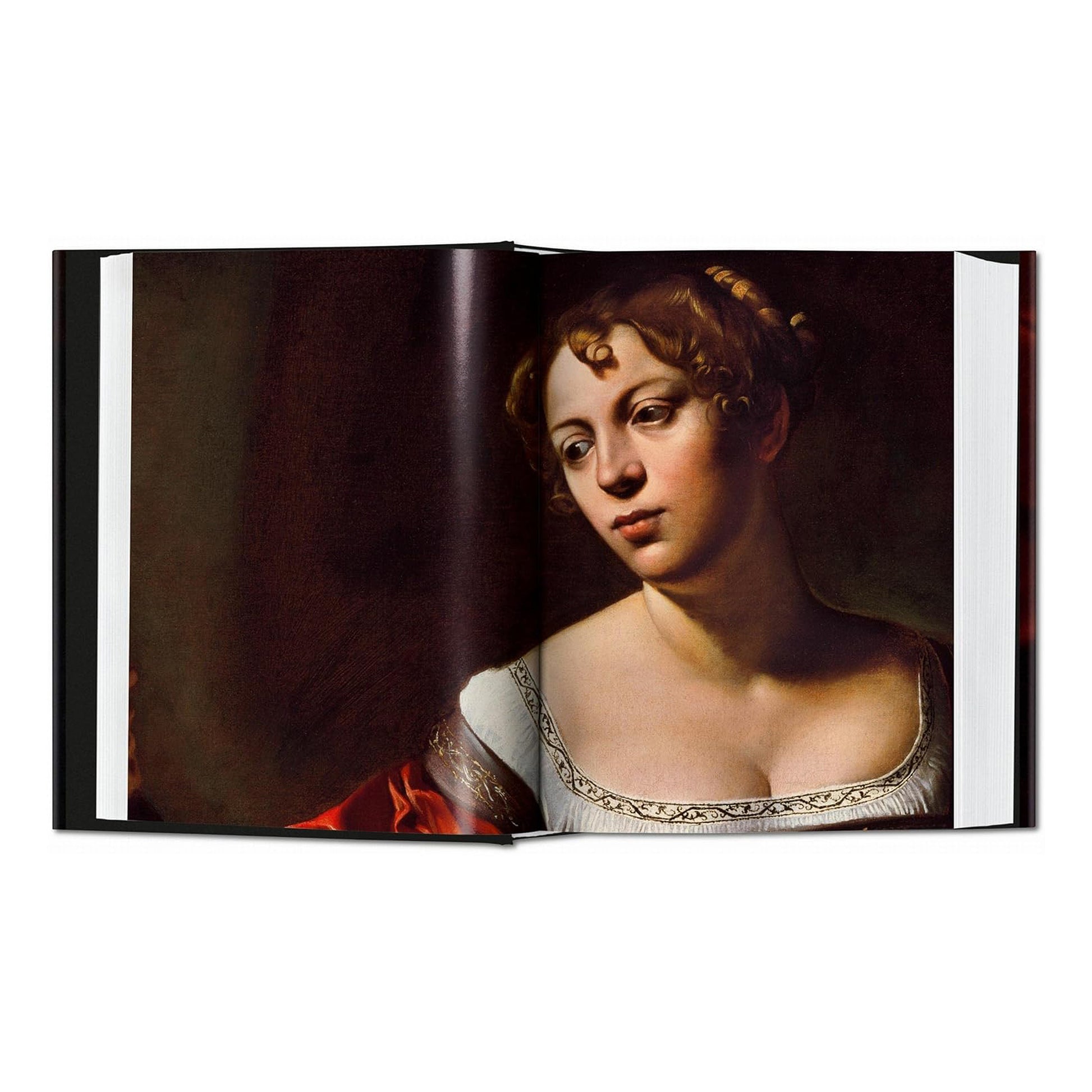 An inside view of the luxury TASCHEN art book, focusing on a detail from the painting 'Martha and Mary Magdalene' that showcases Caravaggio's mastery of chiaroscuro.