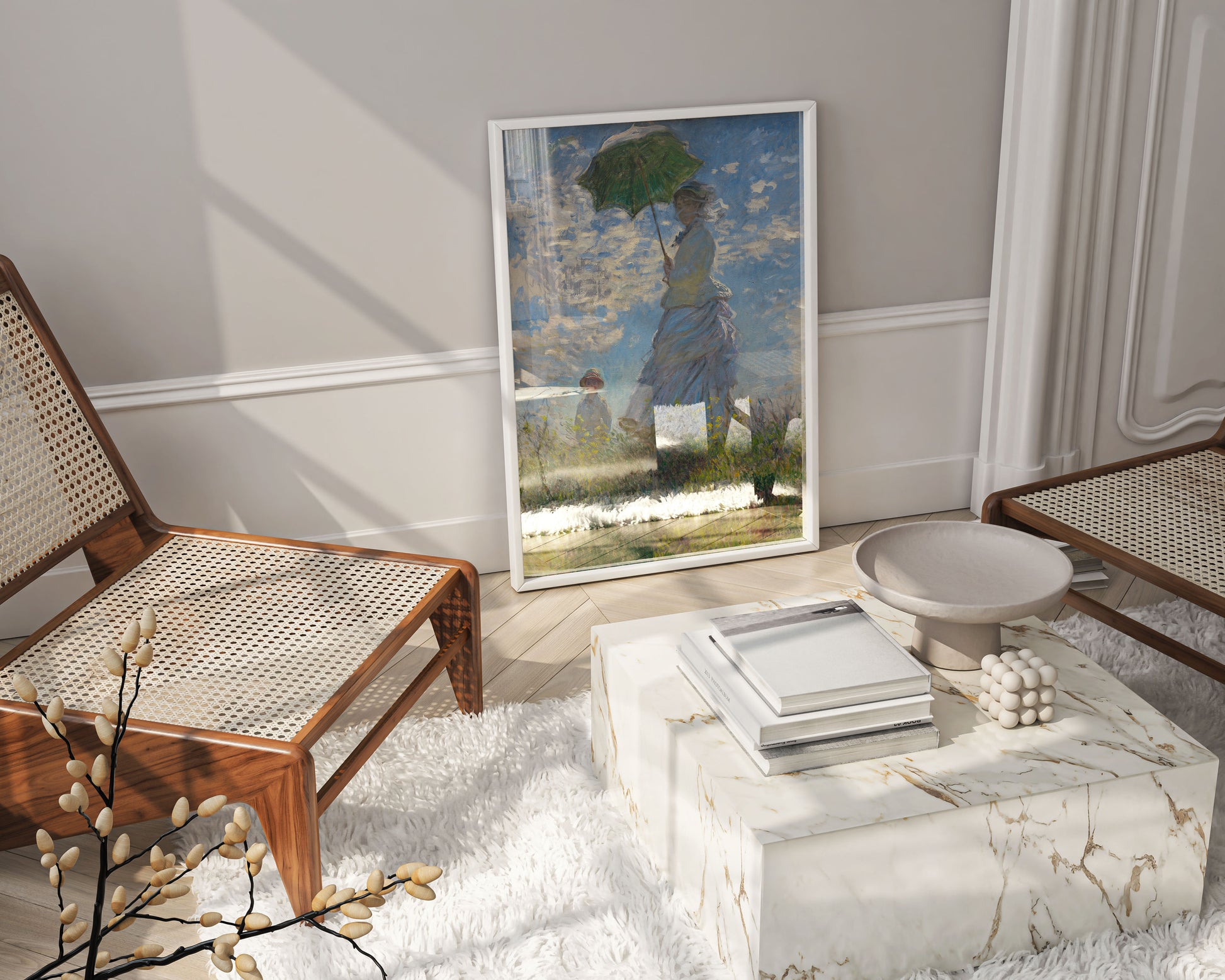 A framed art print of Claude Monet's Impressionist painting, "Woman with a Parasol," leaning against a wall in a modern living room. The wall art is positioned next to two rattan chairs, a marble coffee table, and a fluffy white rug, showcasing how the classic artwork can be integrated into contemporary home decor.