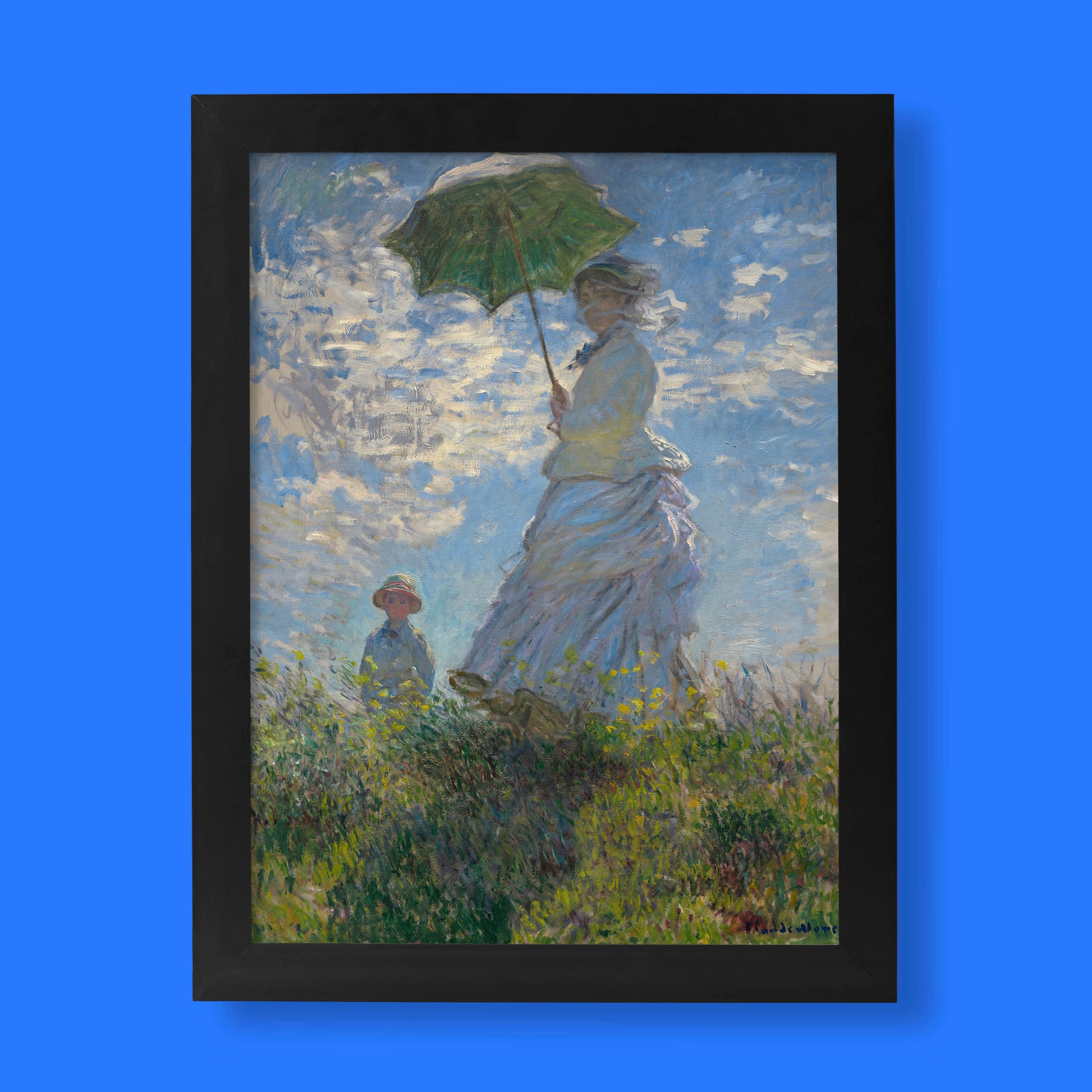 A high-quality fine art print of Claude Monet's famous Impressionist painting, "Woman with a Parasol," showing a woman holding a green parasol in a sunlit field.