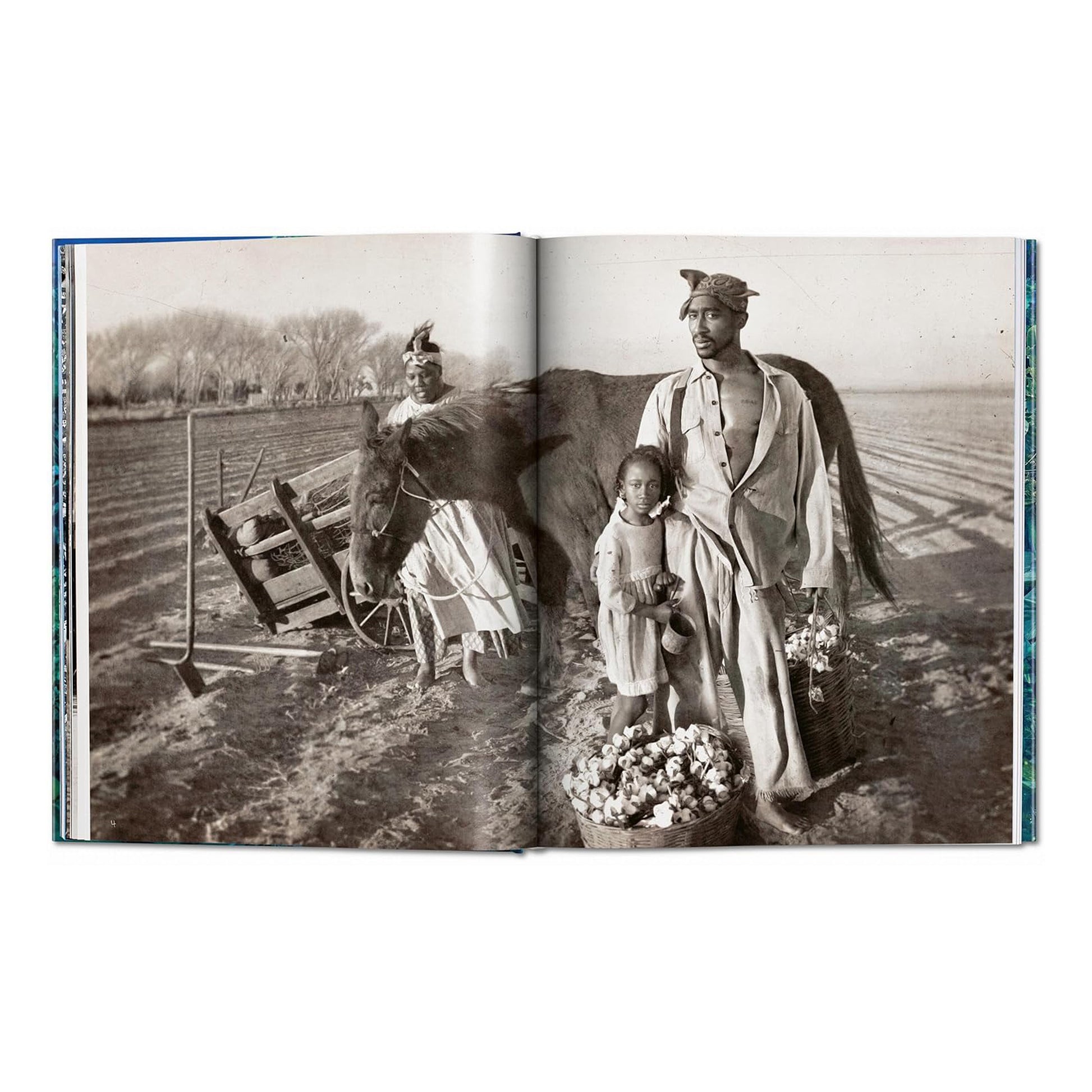 A black and white photograph from the David LaChapelle art book, depicting a man and a girl with a horse and basket of cotton in a field. The man is Tupac Shakur.