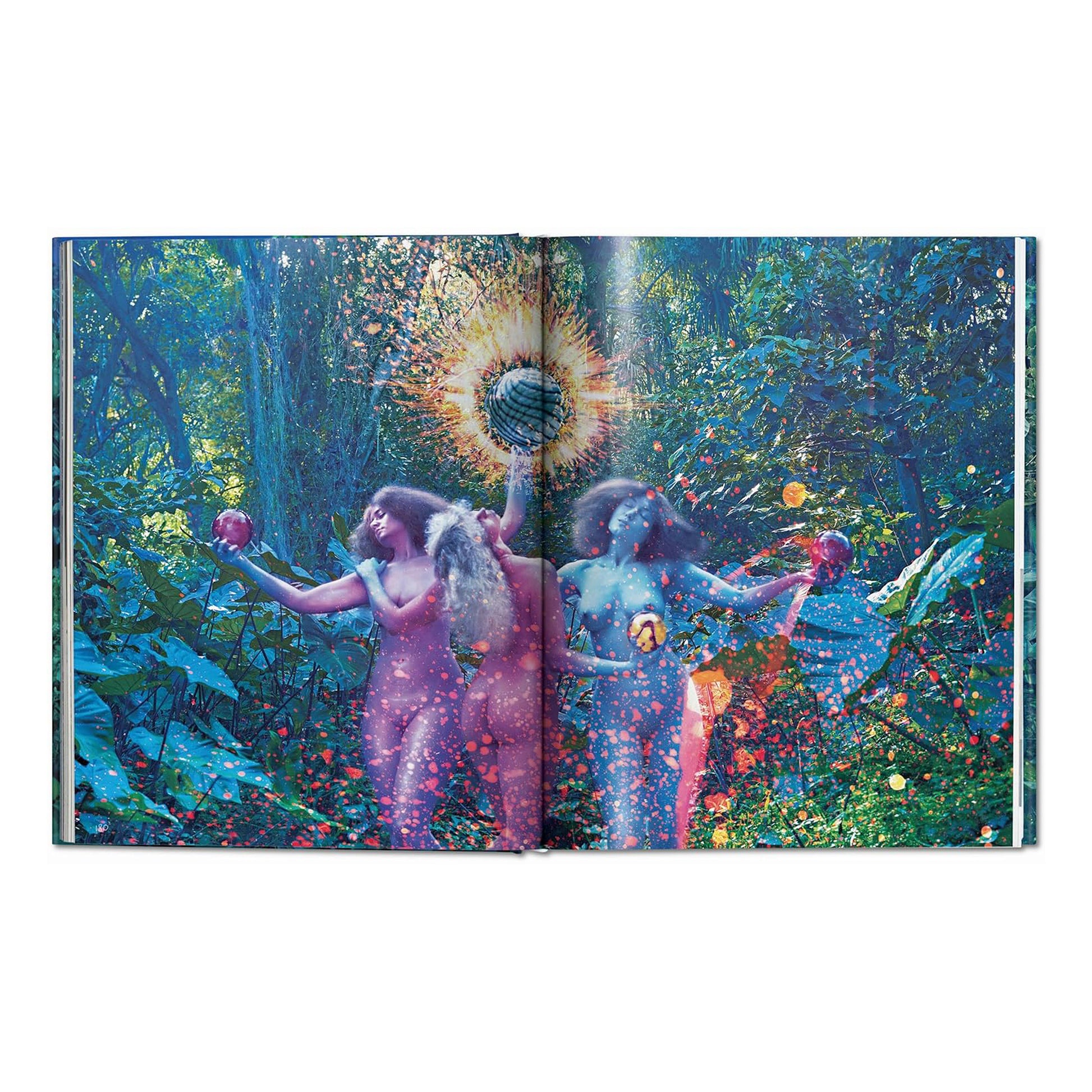 A double-page spread from the David LaChapelle Good News hardcover book, featuring a surreal fine art photograph with vibrant colours of figures in a jungle setting.