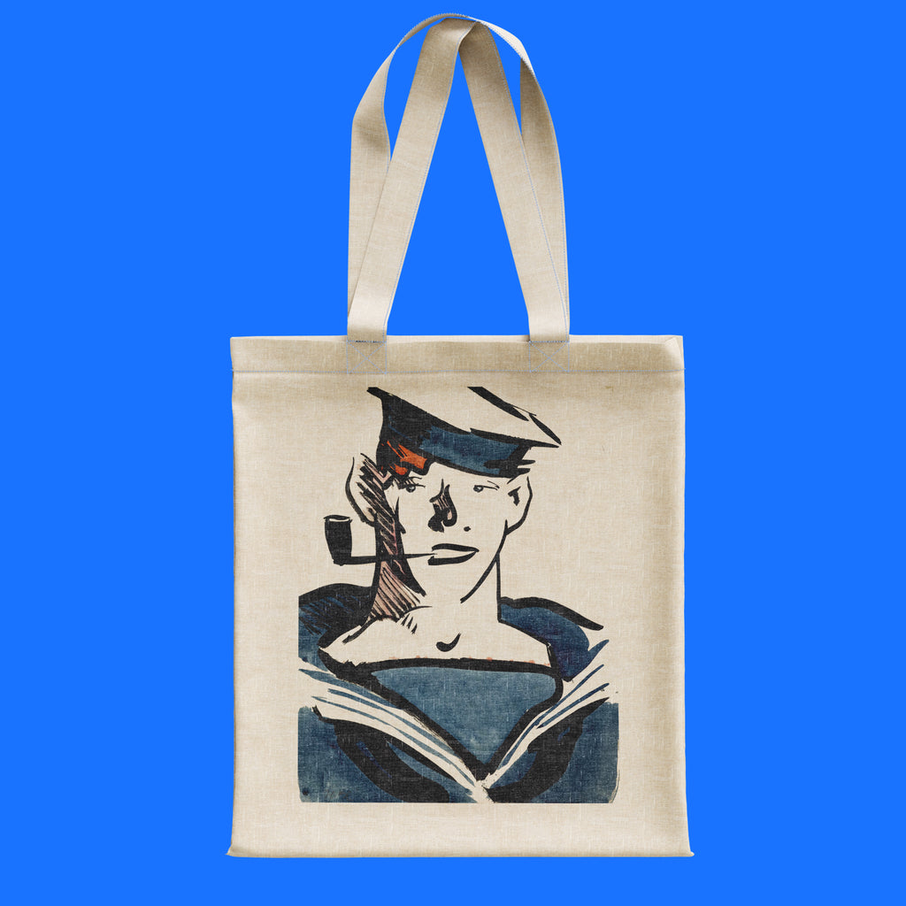 Francis Cadell A Sailor art tote bag hanging on rail, featuring Scottish Colourist navy blue sailor portrait print on natural cotton canvas with reinforced handles