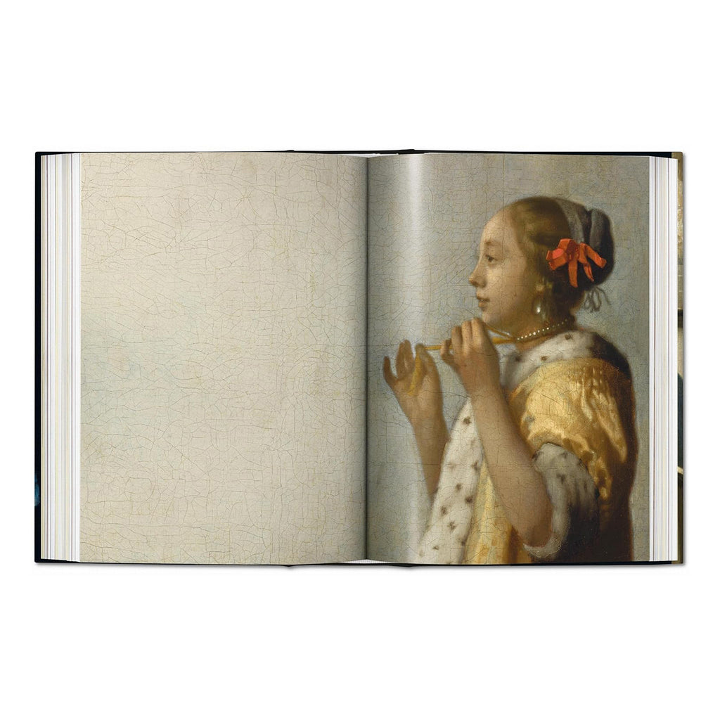 A stunning image of the painting 'Woman with a Lute' from the definitive TASCHEN art book on Dutch master Johannes Vermeer.