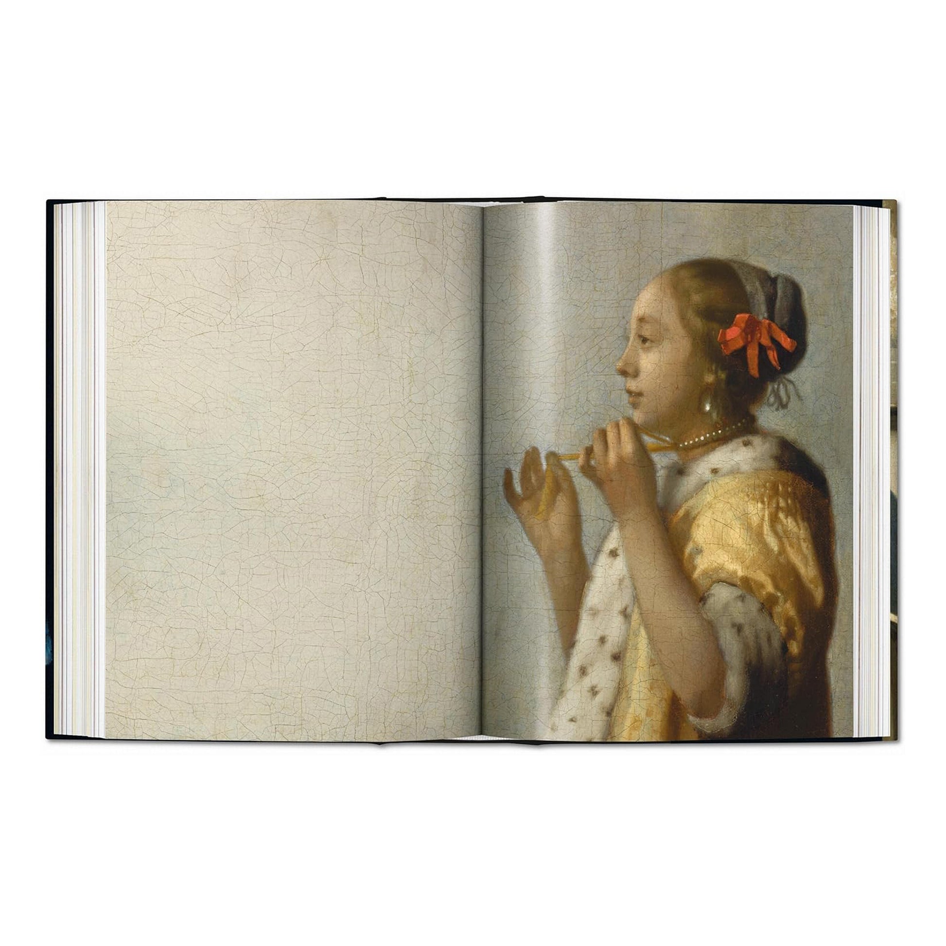 A stunning image of the painting 'Woman with a Lute' from the definitive TASCHEN art book on Dutch master Johannes Vermeer.