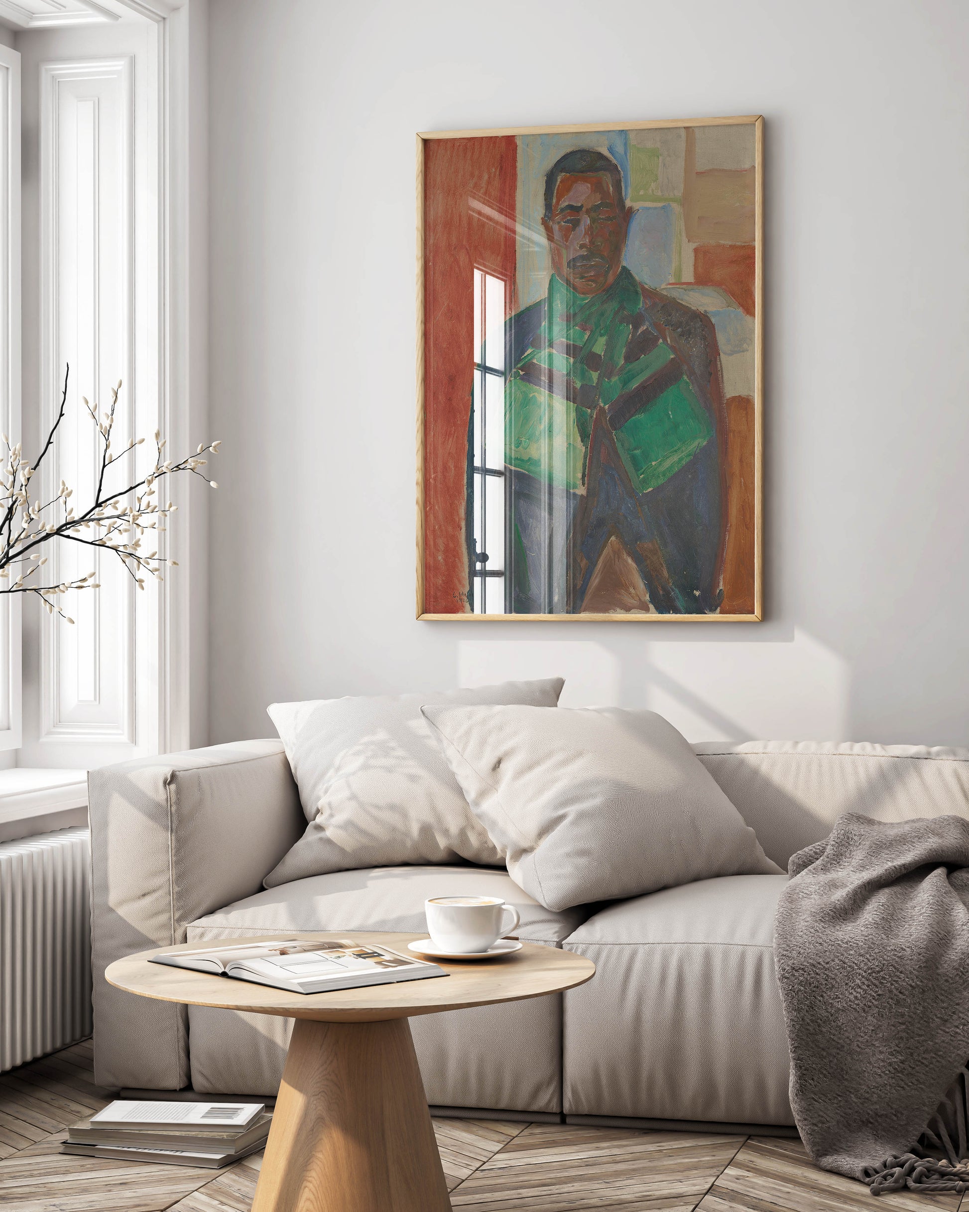 A framed fine art print of Edvard Munch's "Abdul Karim with a Green Scarf" hanging on a white wall in a modern living room.