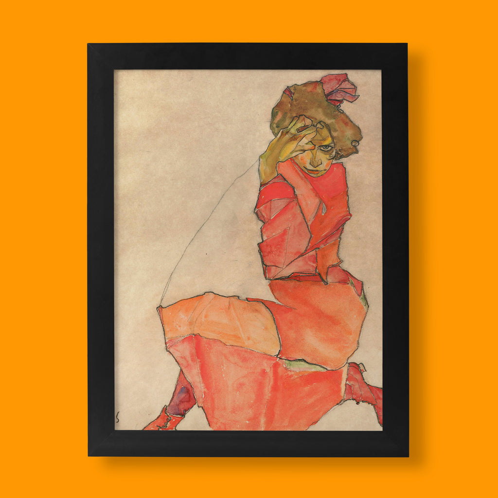 Egon Schiele Kneeling Female in Orange-Red Dress fine art print, a 1910 Austrian Expressionist figure study in vivid orange and red.