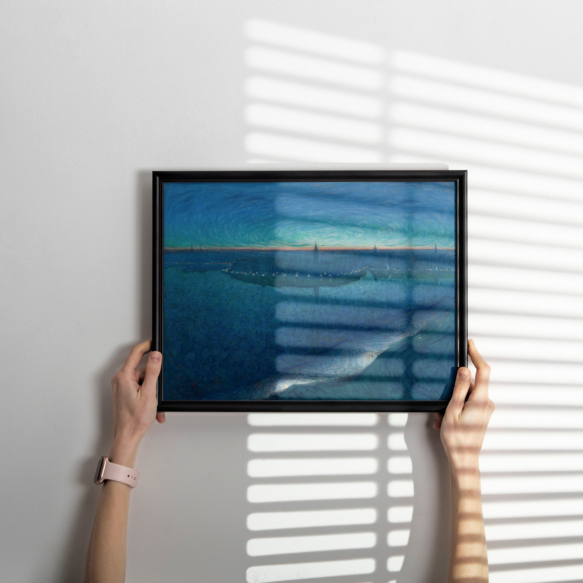 Scandinavian landscape art prints featuring Jansson's Dawn over Riddarfjärden as centrepiece in curated gallery wall with complementary blue impressionist wall art