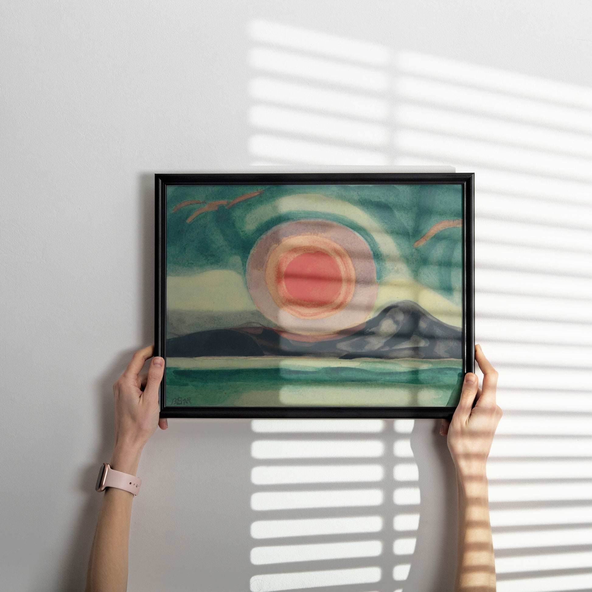 Elegant framed Oscar Bluemner Sunset on the St. Lawrence fine art print on a neutral interior wall.