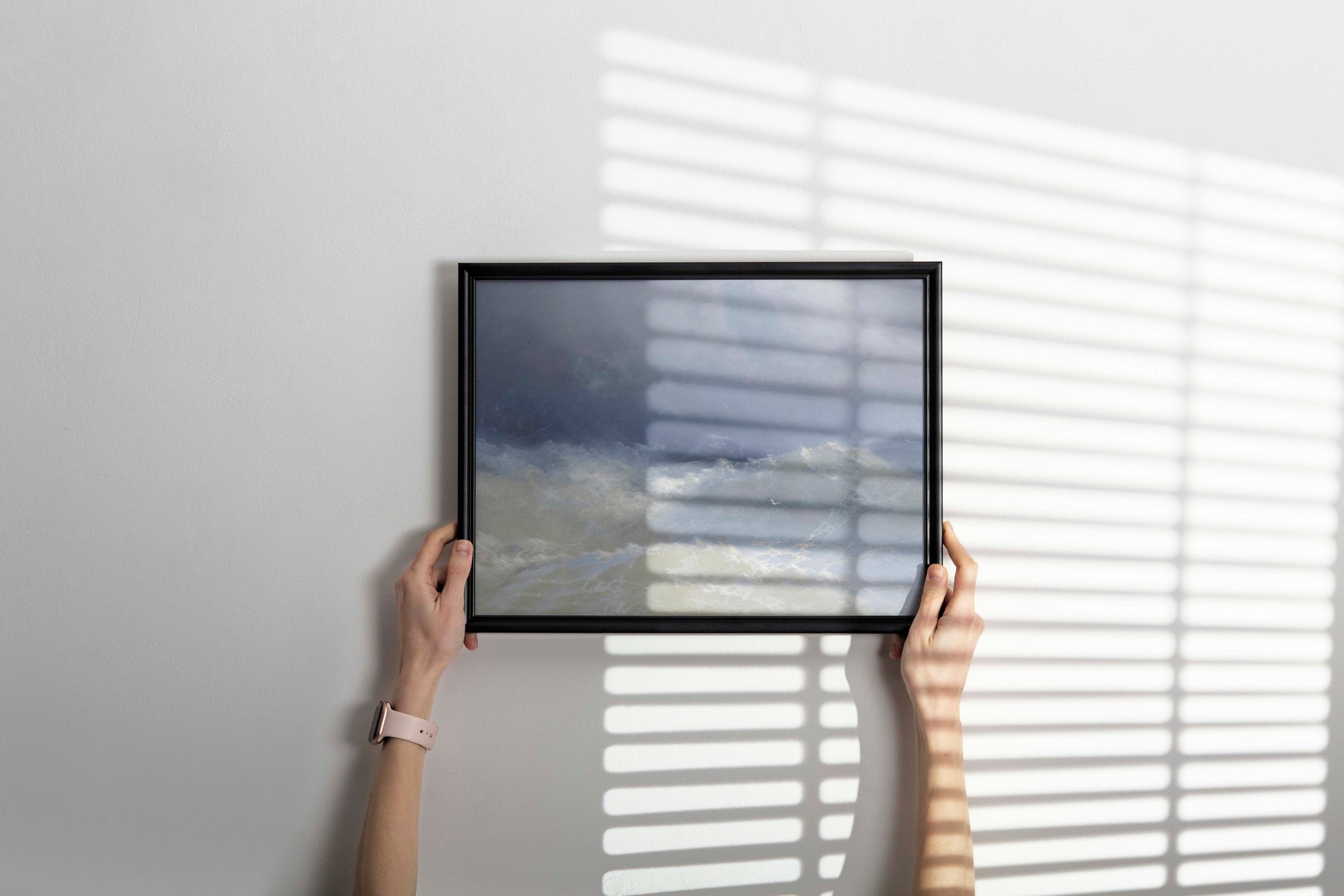 Framed reproduction of Ivan Aivazovsky's Among The Waves masterpiece hanging as elegant wall decor, featuring towering waves and stormy maritime scene in home setting