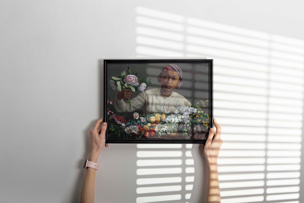 Framed art print of Bazille's Young Woman with Peonies positioned as a statement piece in a modern, luxurious interior design setting.
