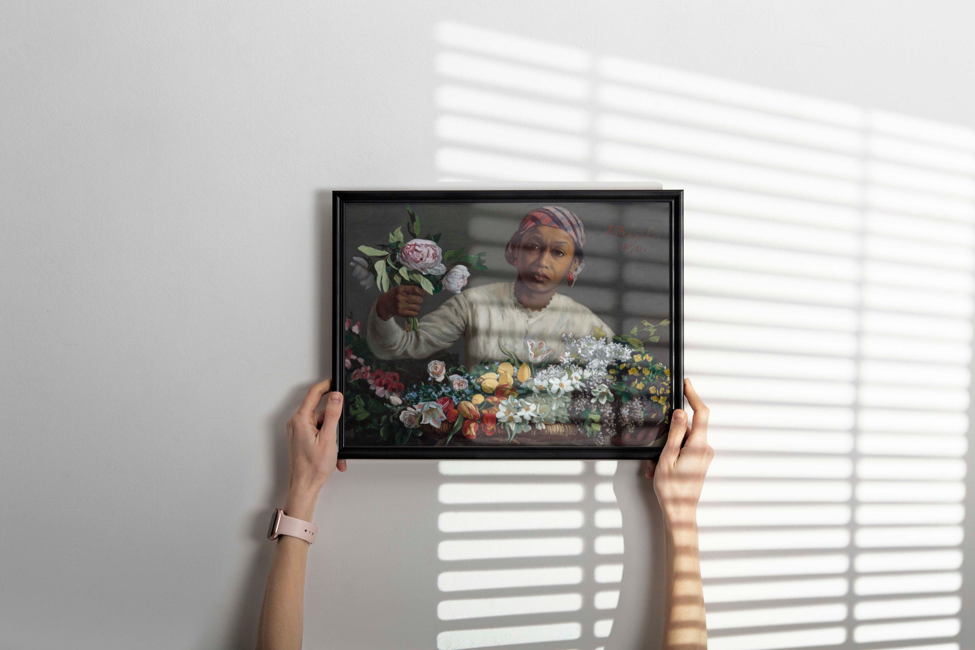 Framed art print of Bazille's Young Woman with Peonies positioned as a statement piece in a modern, luxurious interior design setting.