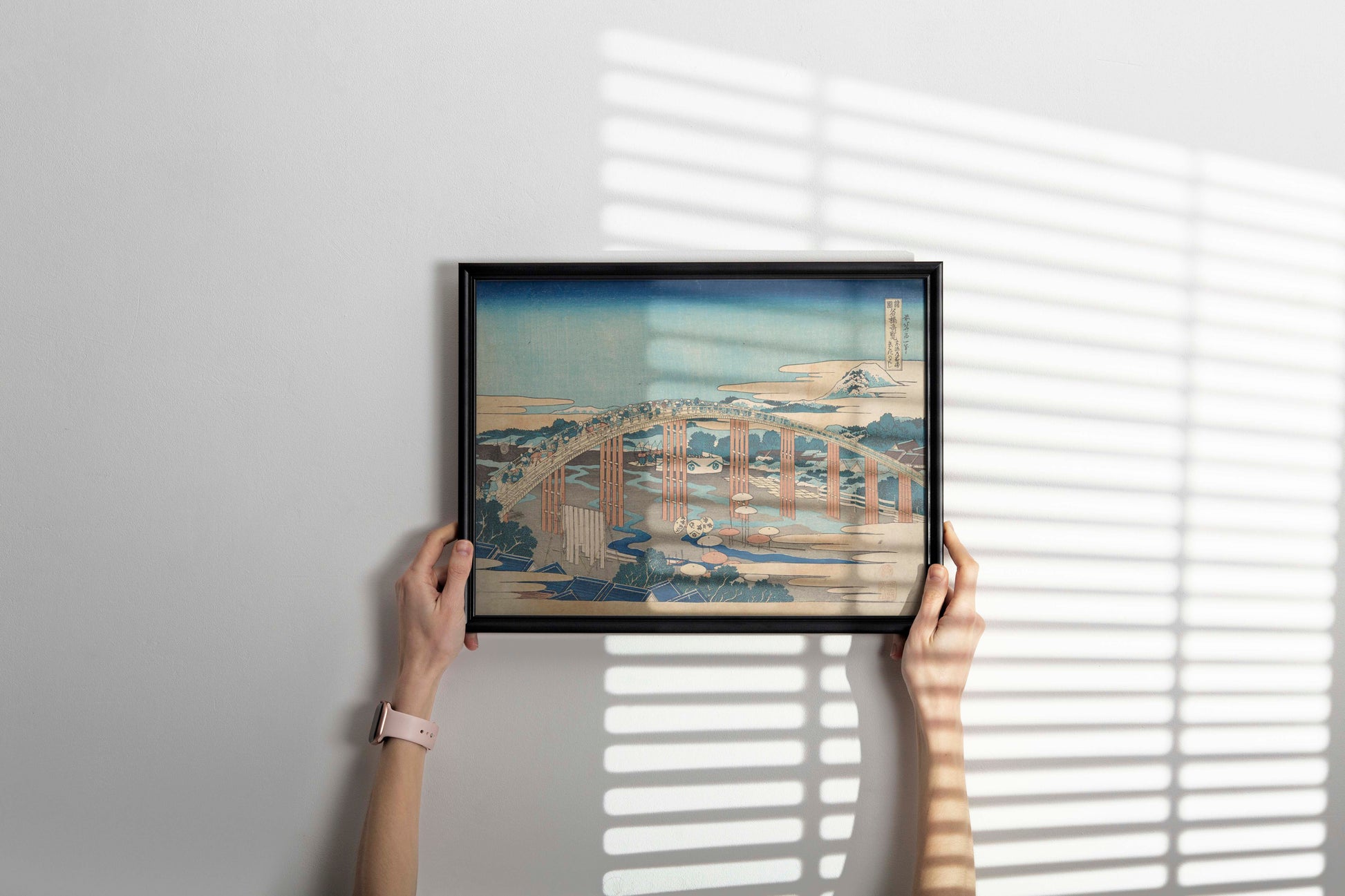 Hokusai Tokaido bridge print in contemporary black frame hung as statement wall art, demonstrating how Japanese fine art enhances modern home decoration and gallery wall displays