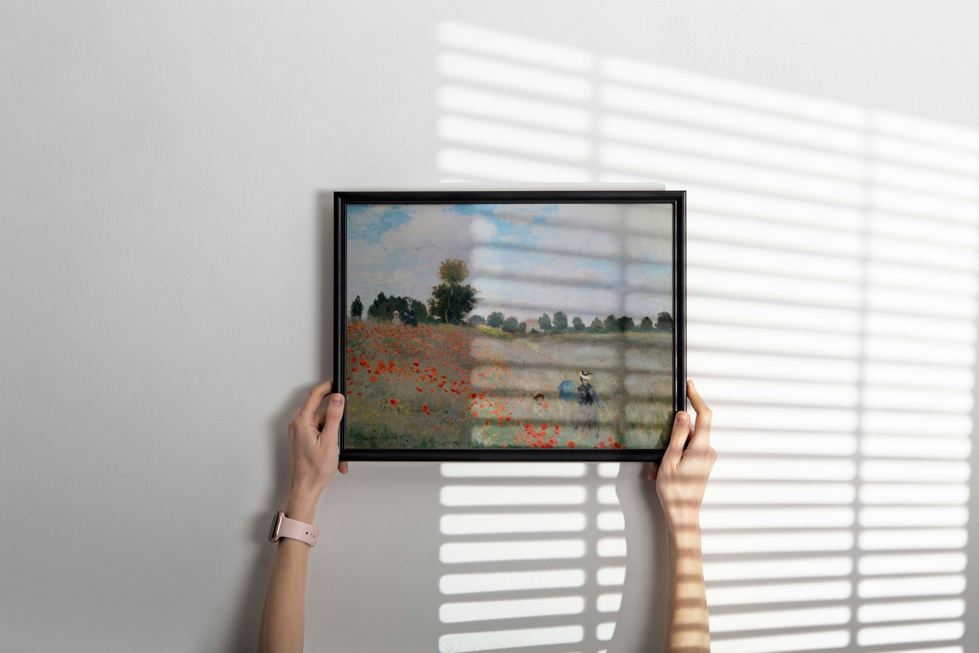 Framed Claude Monet Poppy Field wall art in a sleek black frame, showcasing the iconic Impressionist painting as stylish home decor.