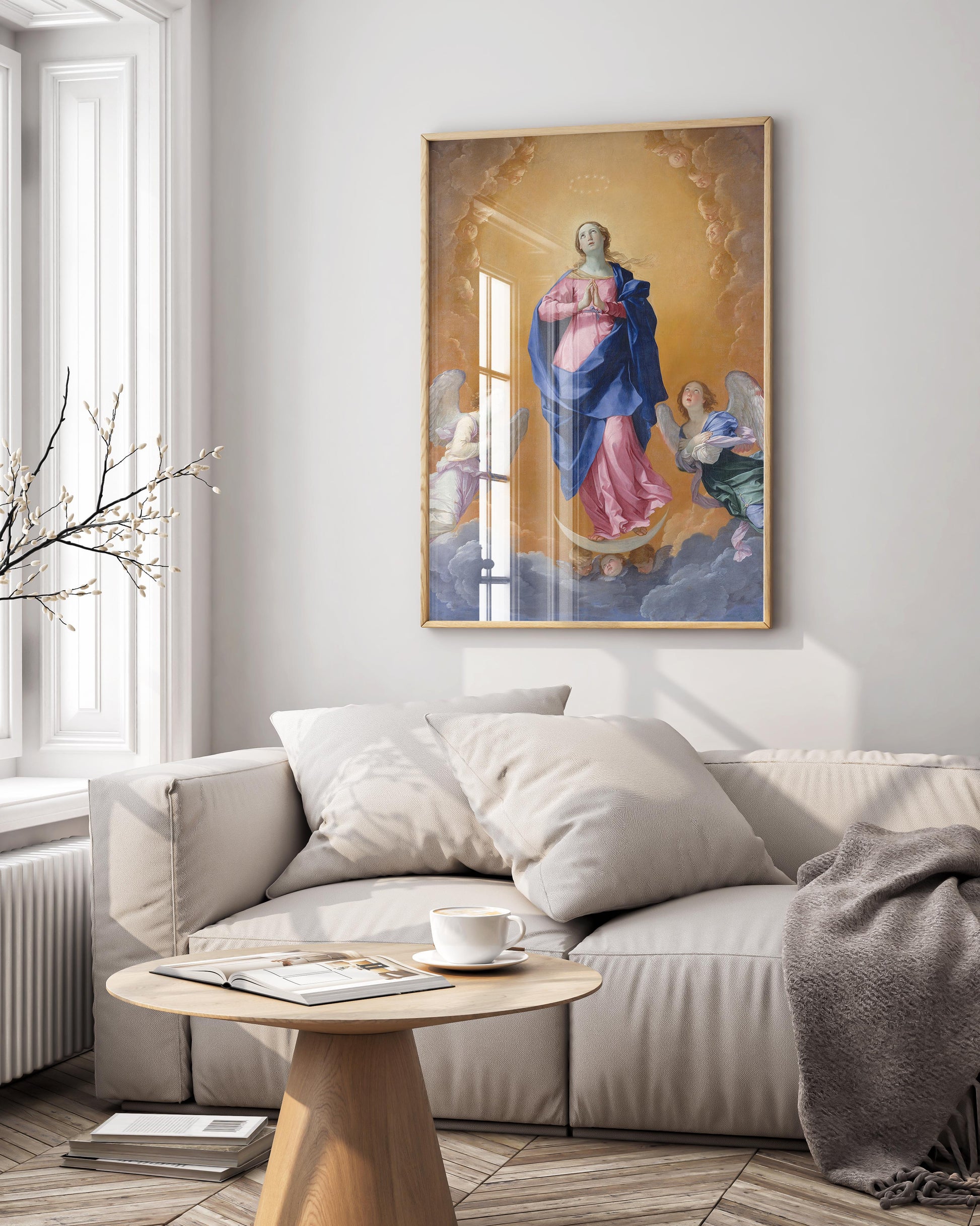 A framed fine art print of Guido Reni's Baroque painting "The Immaculate Conception" hanging as elegant wall art in a modern, luxury living room, enhancing the home's interior design.