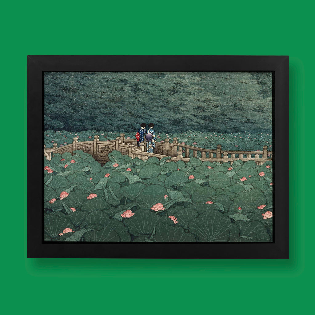 Hasui Kawase The Pond at Benten Shrine in Shiba Japanese woodblock print featuring two figures in kimono crossing a stone bridge surrounded by lotus leaves and pink flowers