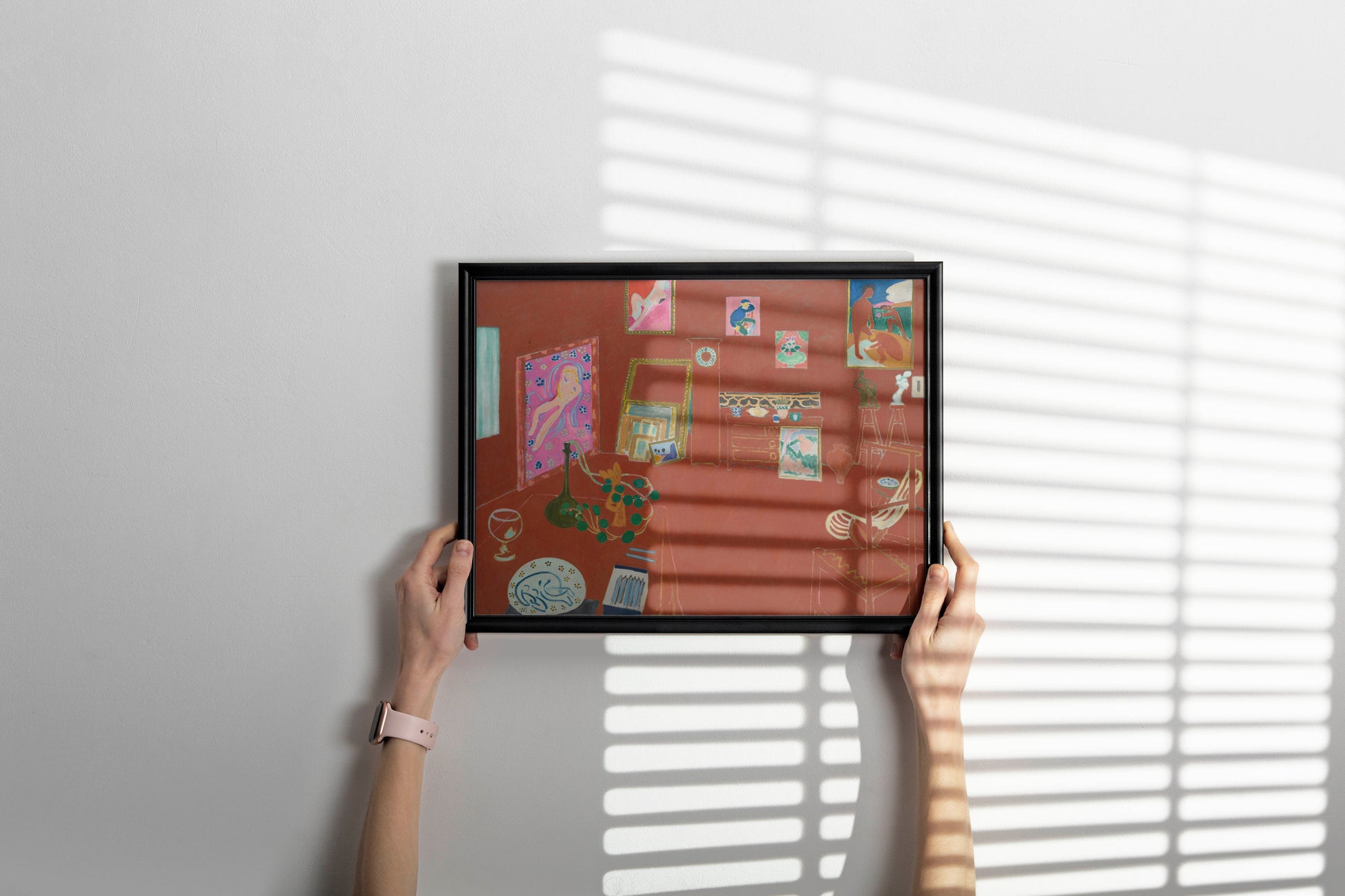 Framed Henri Matisse Red Studio fine art print as stylish home decor wall art showcasing bold red interior painting in contemporary setting