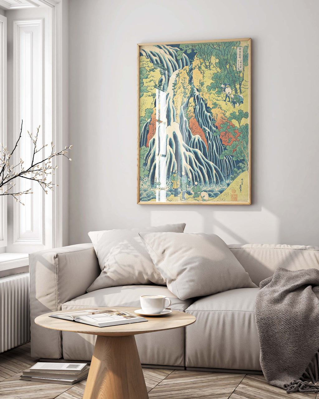 Framed Hokusai waterfall landscape art print hanging on gallery wall, blue and white Japanese wall art in contemporary frame perfect for living room decor