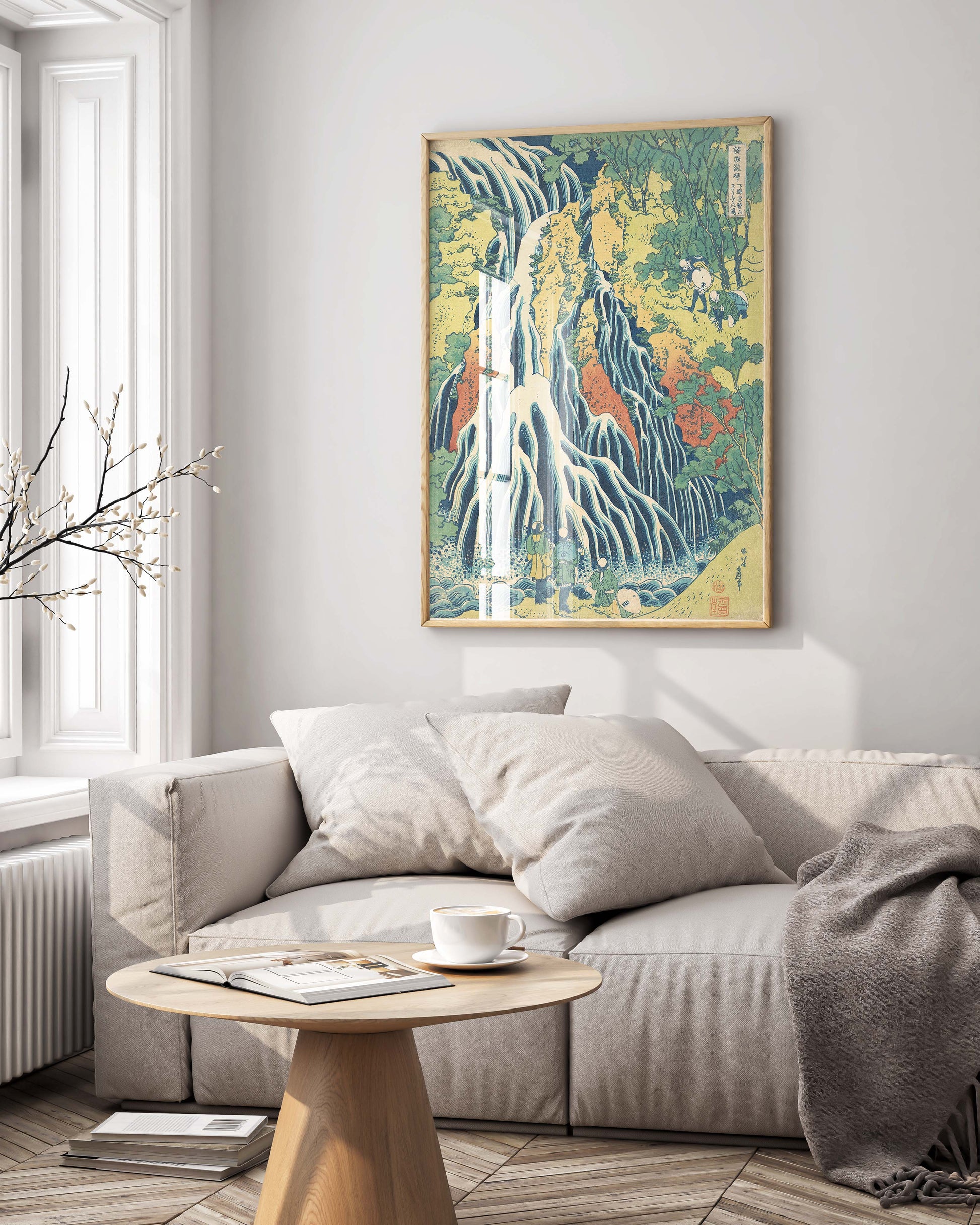 Framed Hokusai waterfall landscape art print hanging on gallery wall, blue and white Japanese wall art in contemporary frame perfect for living room decor