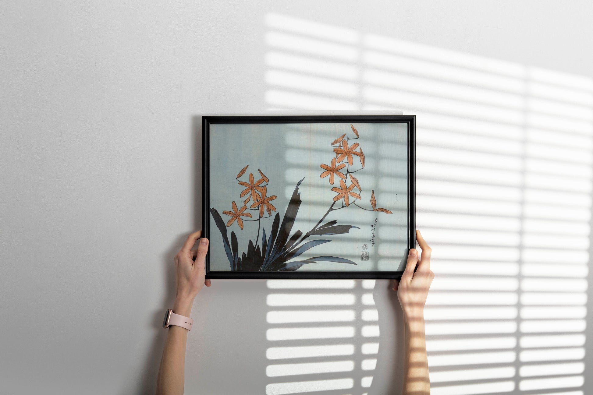 Katsushika Hokusai Orange Orchids framed art print displayed on wall, Japanese botanical wall art in modern interior, ukiyo-e framed poster home decor