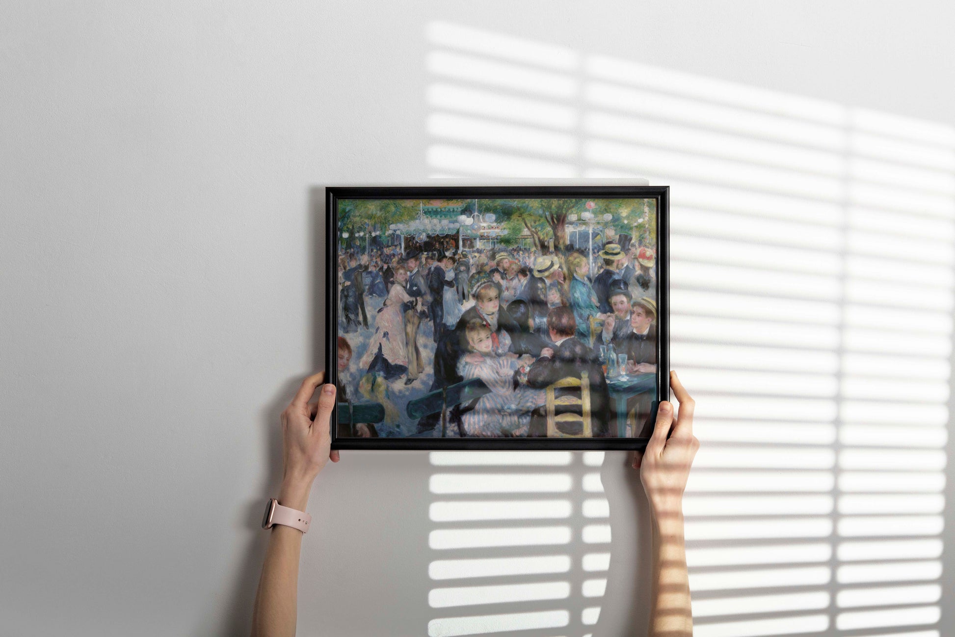 Pierre-Auguste Renoir Impressionist masterpiece framed wall art print hanging in dining room, featuring classic French Montmartre scene reproduction for sophisticated home interior design