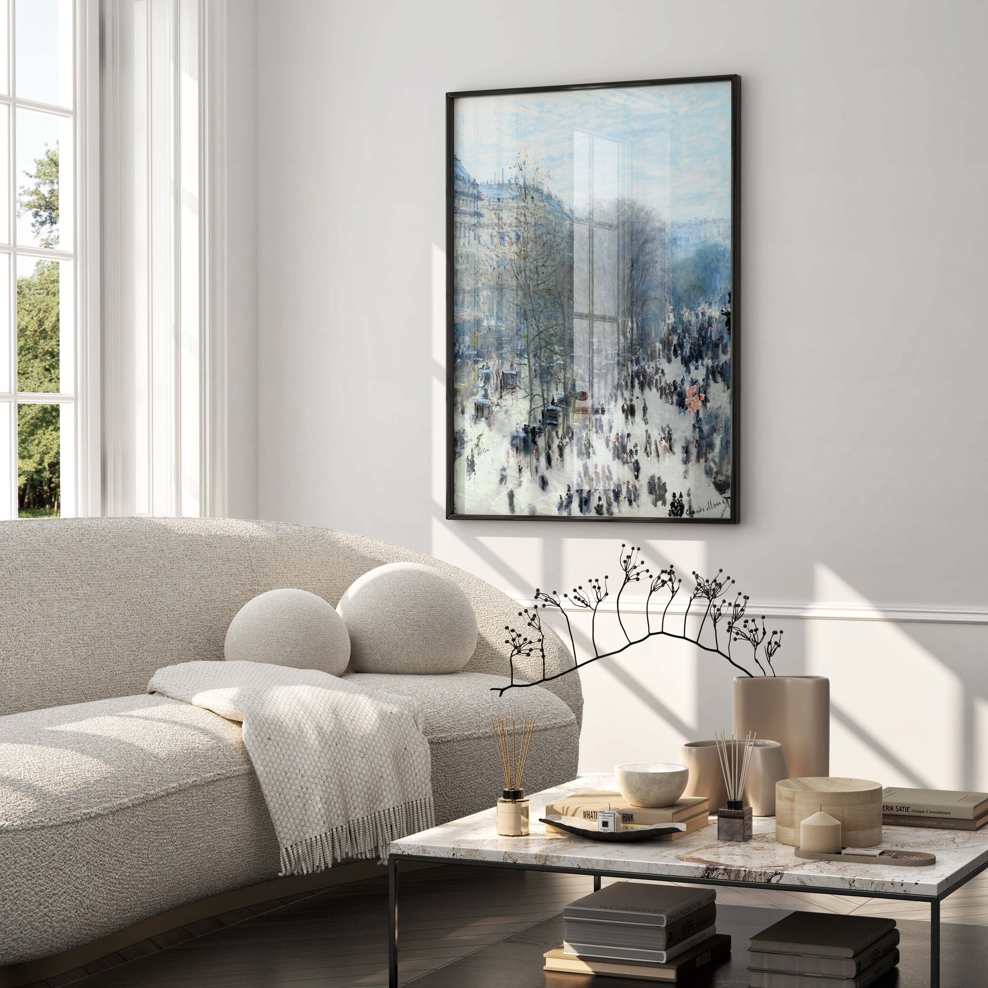 A large, framed fine art print of Claude Monet's "Boulevard des Capucines" hanging on a wall in a luxurious, modern living room.