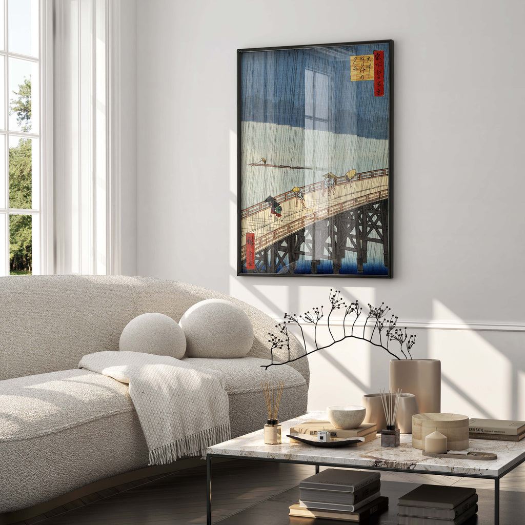 A large, elegant framed Japanese woodblock print by Hiroshige serving as the main wall decor in a modern, minimalist luxury living room.