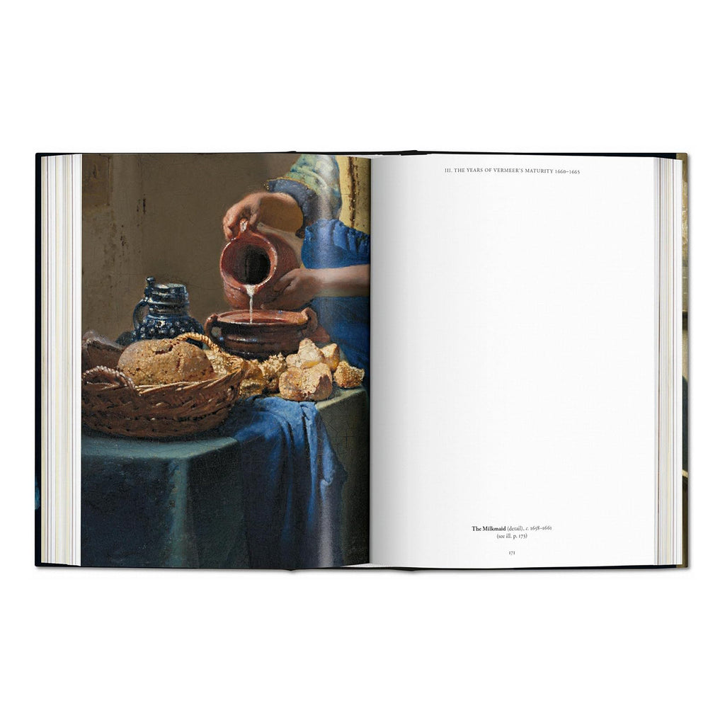 A full-page photo from the Vermeer coffee table book showing a close-up detail of the Dutch Golden Age painting 'The Milkmaid.'