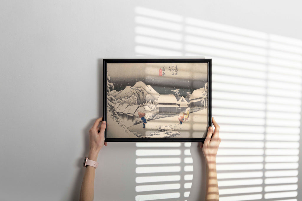 A close-up of a framed giclée fine art print of Hiroshige's iconic snow scene, showcasing the quality of the print and the elegant frame, perfect as a piece of gallery wall art.