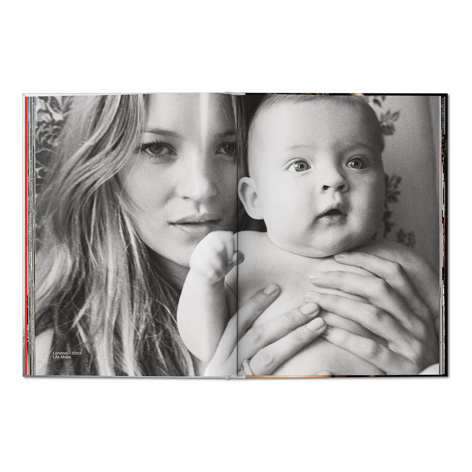A black and white double-page spread. On the left is a close-up of Kate Moss's face. On the right, she is holding a baby.