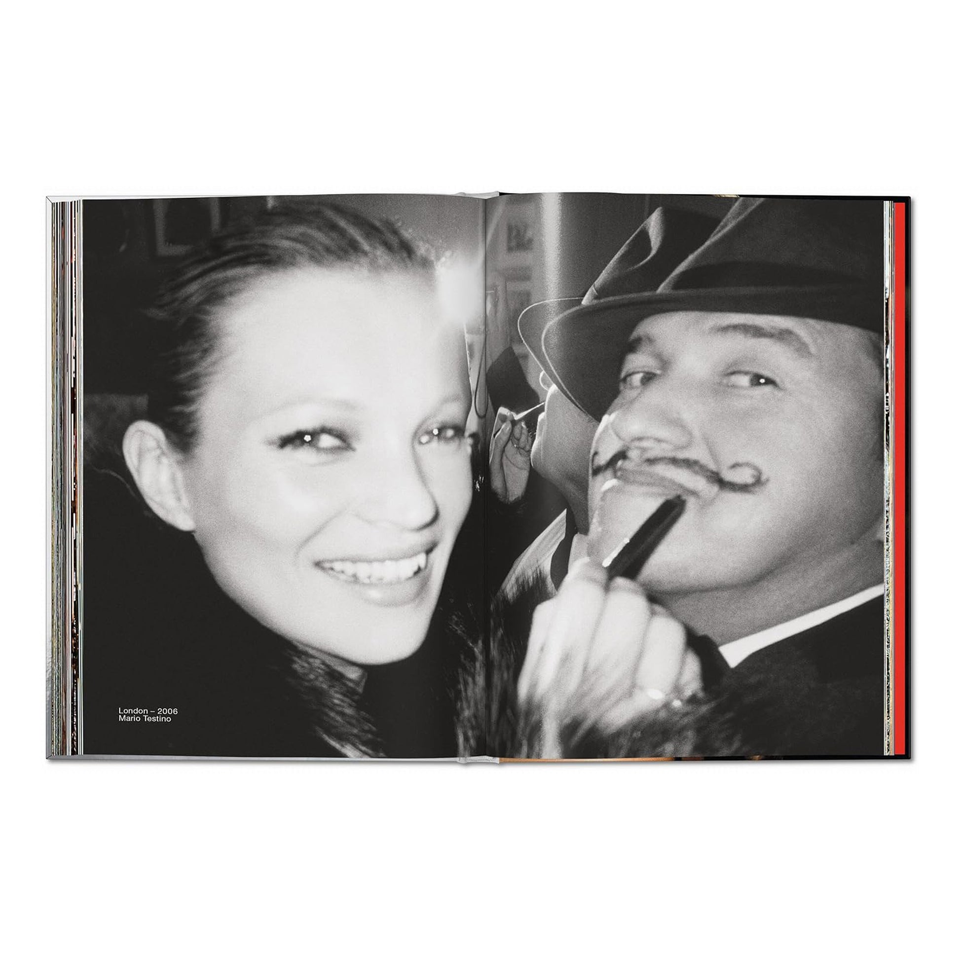 A black and white double-page spread. On the left is a smiling close-up of Kate Moss's face. On the right, a man with a mustache and a hat is holding a cigarette holder. The caption reads "London - 2006 Mario Testino."