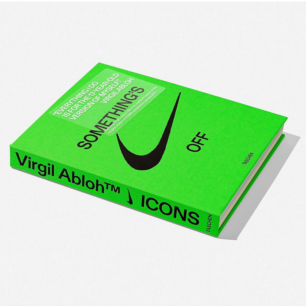 A horizontal view of the open spine of the "Virgil Abloh. Nike. ICONS" coffee table book, showcasing its unique Swiss binding and stacked pages.