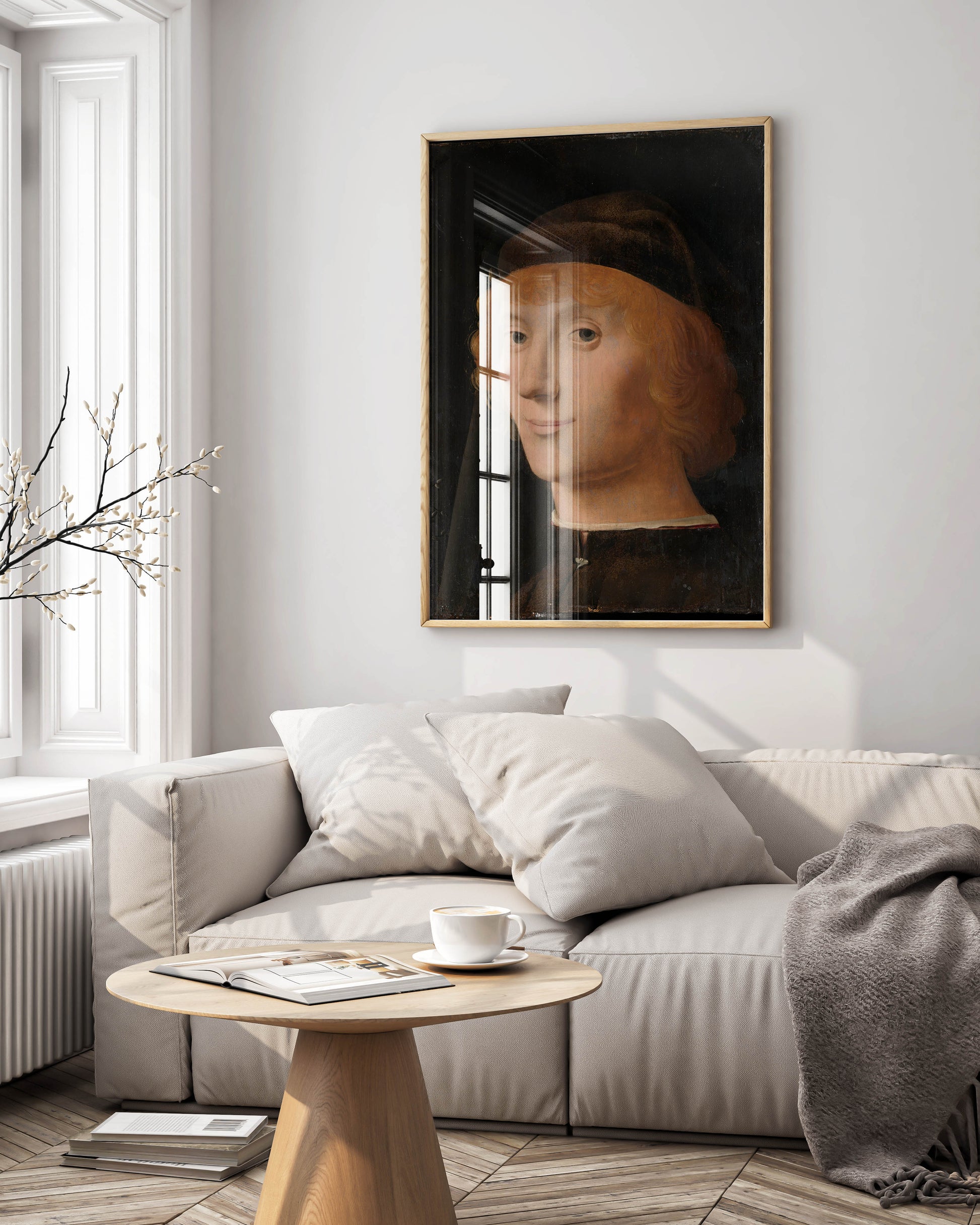 A premium, framed art print of Antonello da Messina's 'Portrait of a Young Man' hanging as a focal point in a luxurious, modern living room.