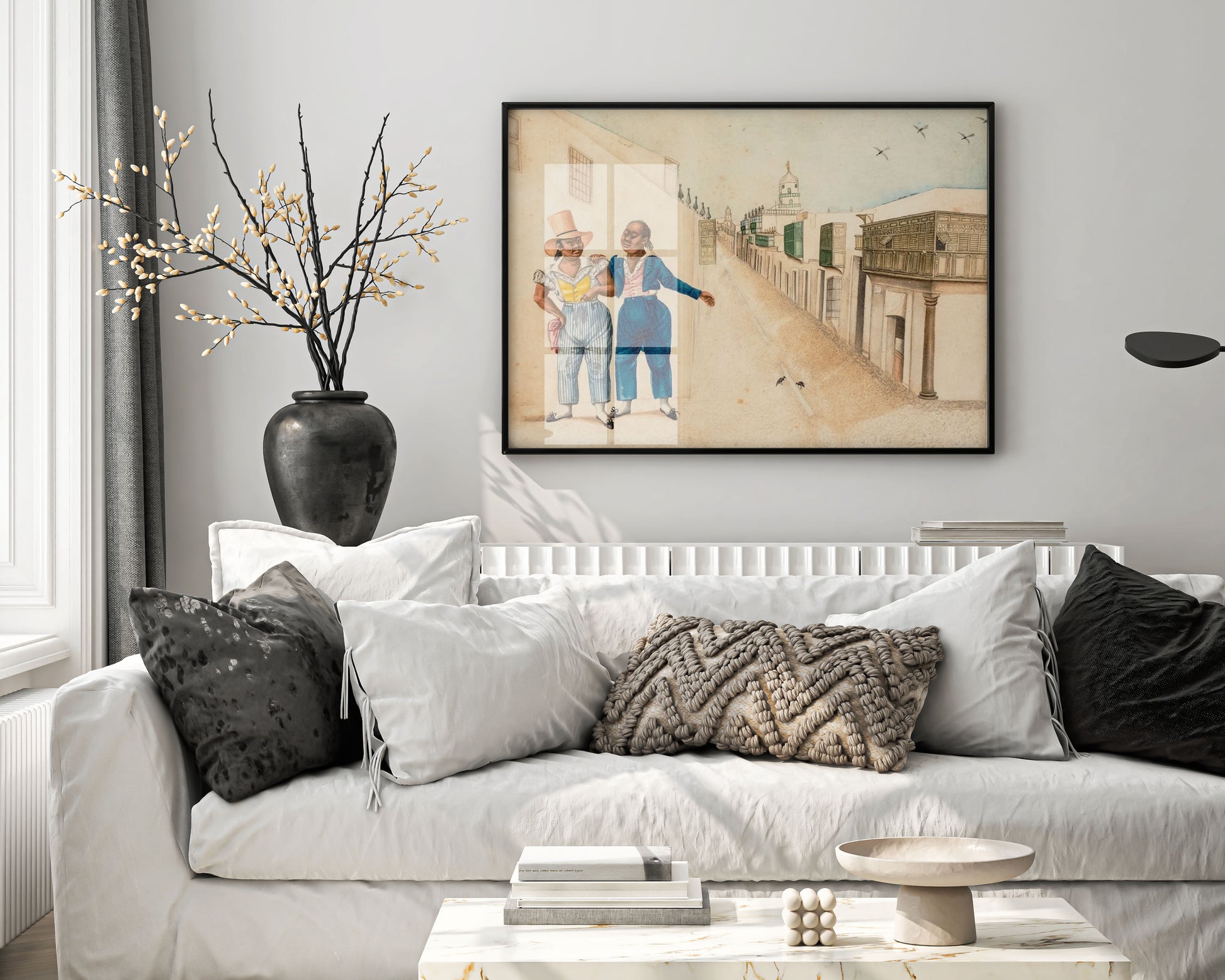 A beautiful, modern living room with a framed giclée fine art print by Francisco Javier Cortés featuring two historical figures, positioned as a striking centrepiece above a sofa.