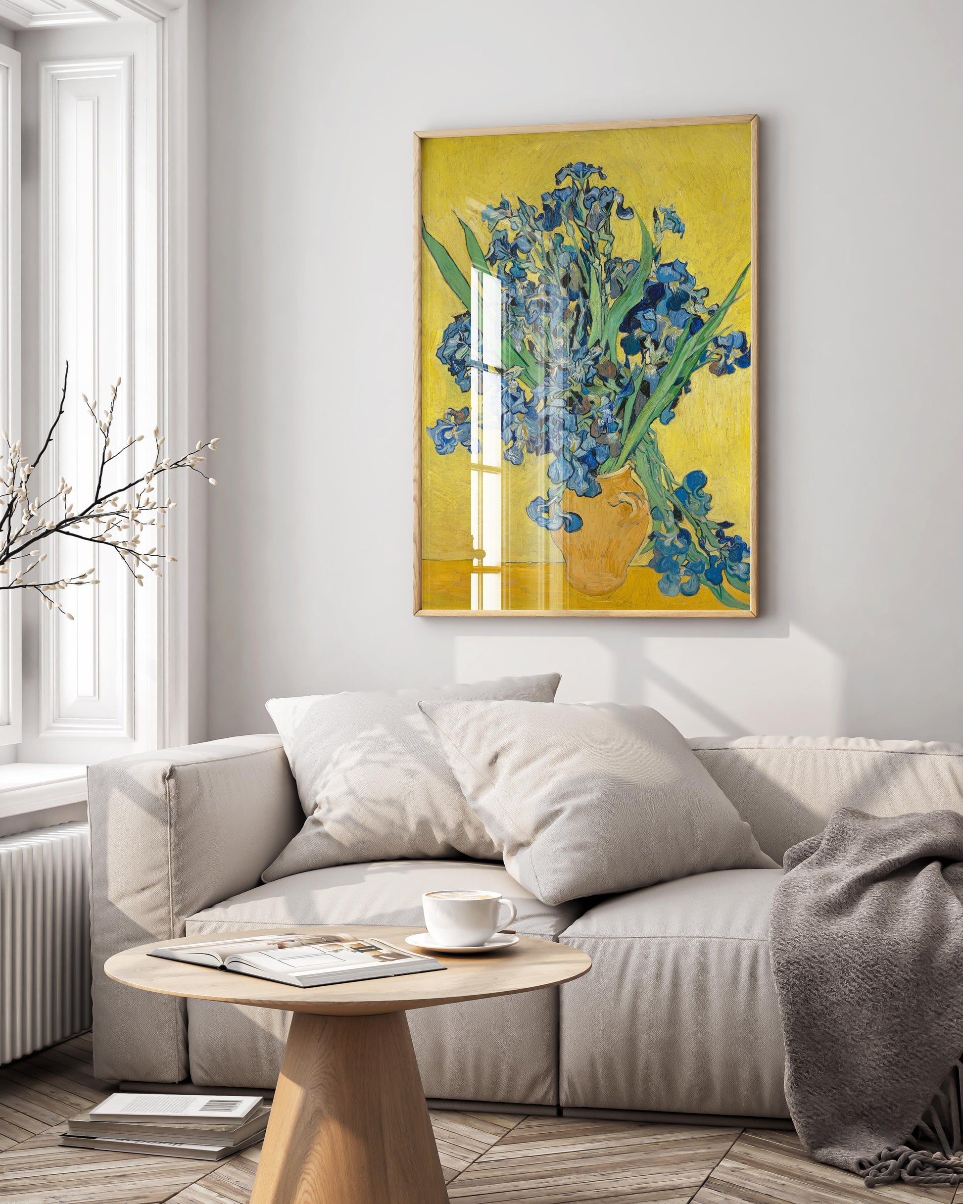 Framed print of Van Gogh's "Irises" painting displayed as stunning wall art in a modern, luxurious living room, enhancing the high-end interior design.