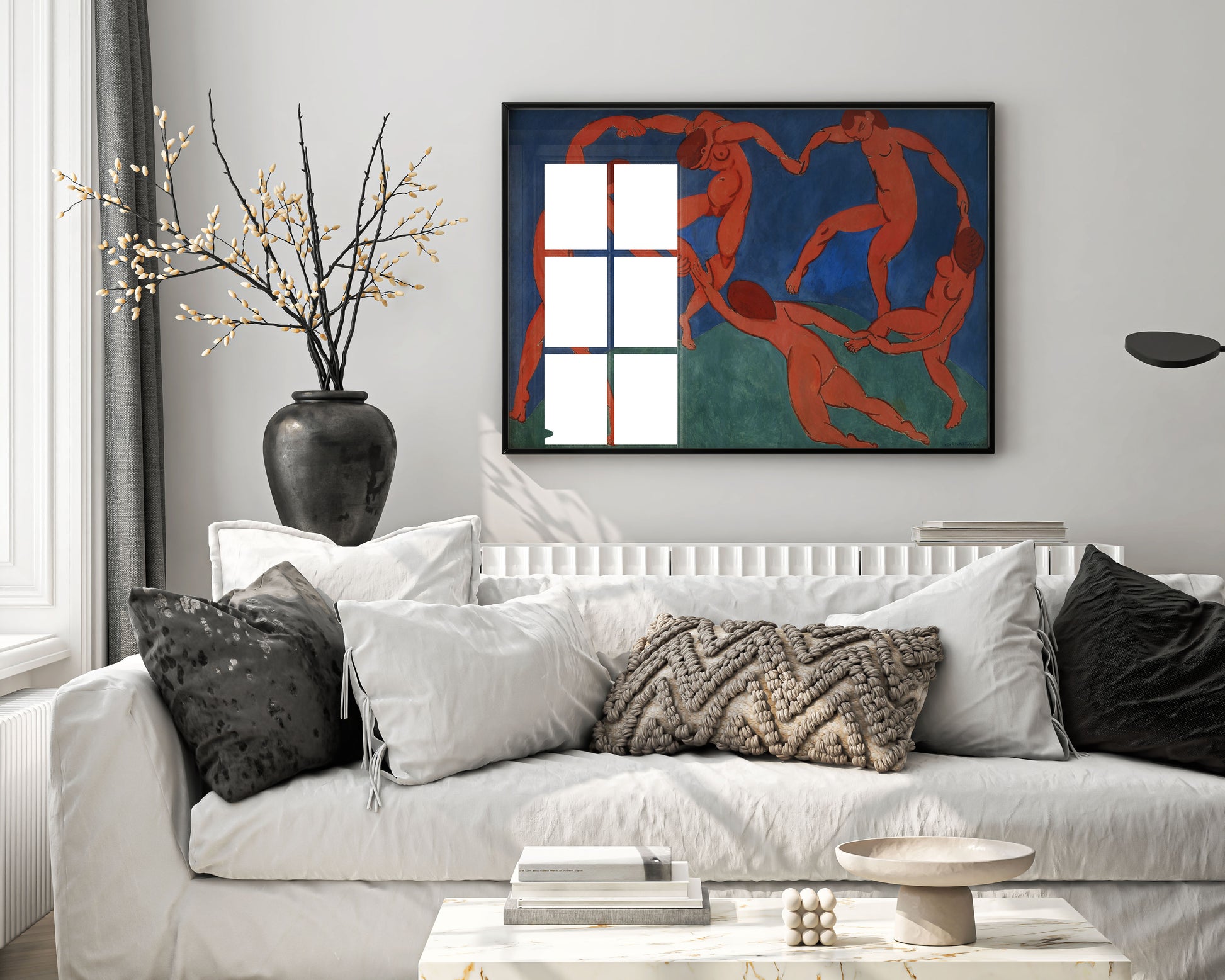 Henri Matisse The Dance framed art print hanging on modern living room wall, showing five dancing red figures in elegant black frame, premium wall decor and interior design inspiration