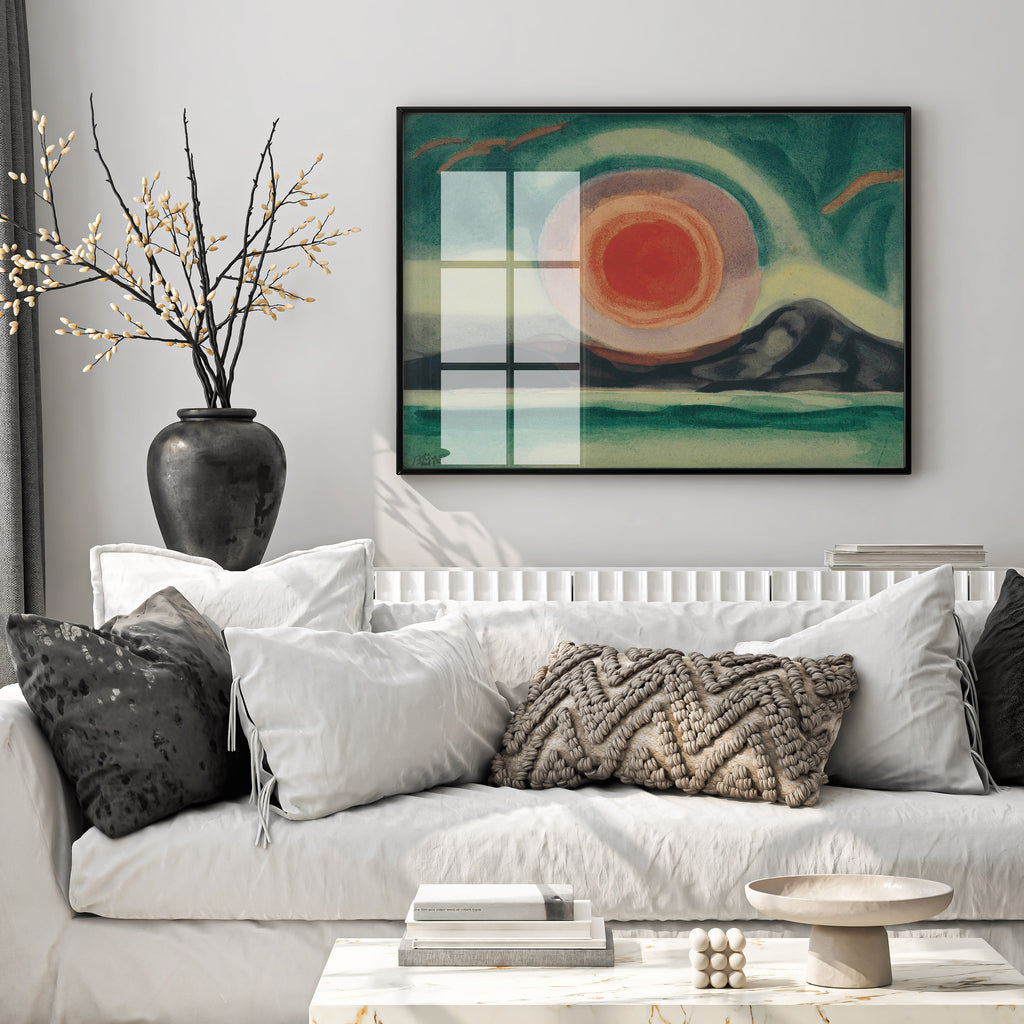 Framed Oscar Bluemner Sunset on the St. Lawrence wall art displayed above a modern sofa in a contemporary living room.