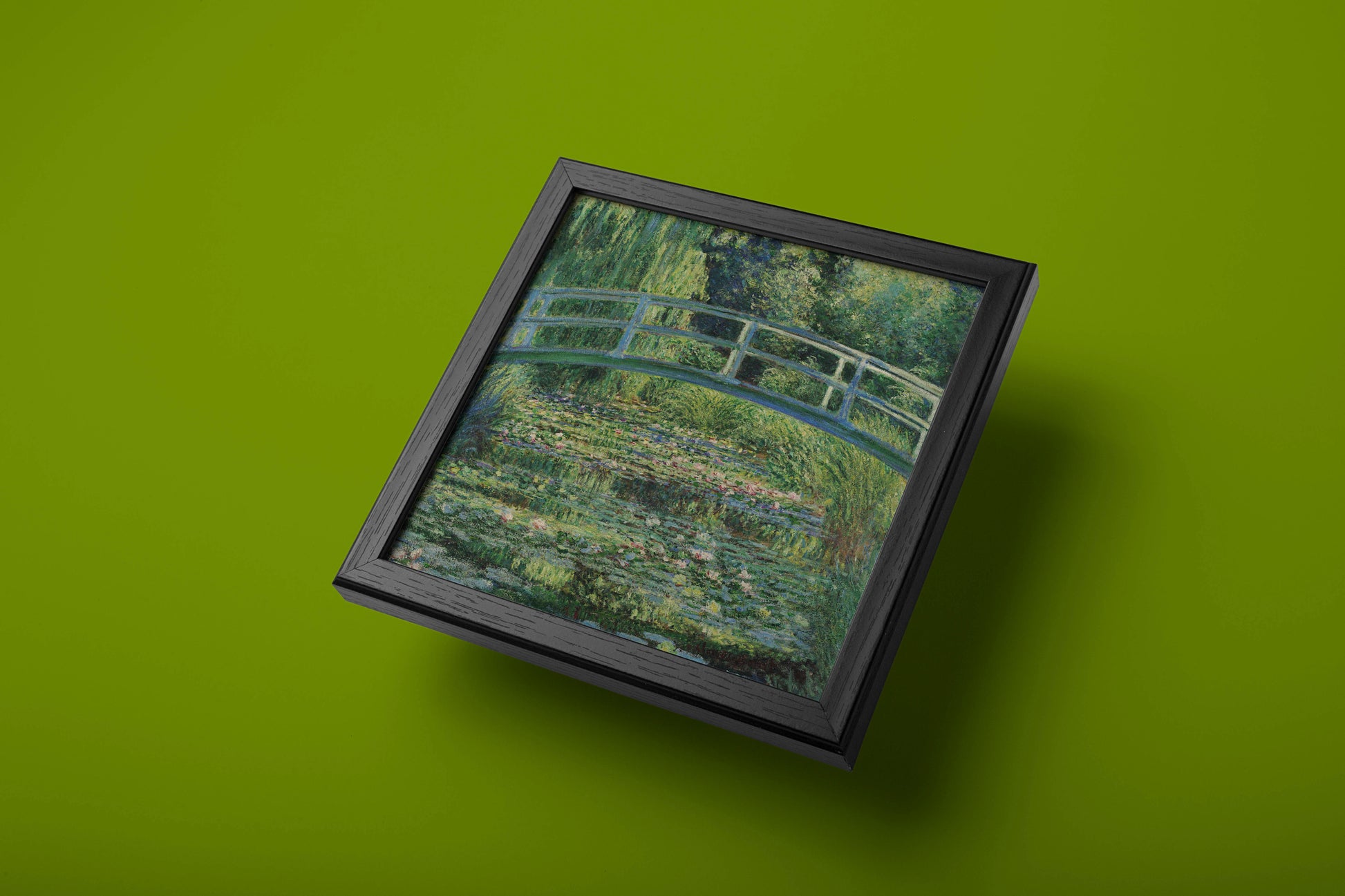 Detail of a fine art wall print capturing the famous Japanese bridge and tranquil water lilies in Monet's garden.