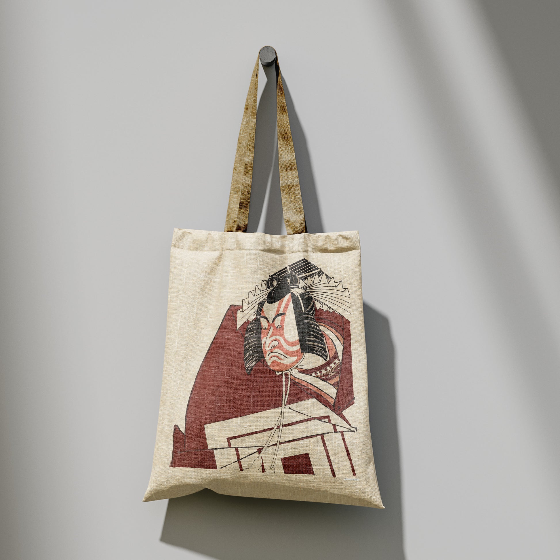Close-up detail of Kabuki theatre art tote bag showing kumadori face paint and traditional Japanese woodblock print design on 100% cotton
