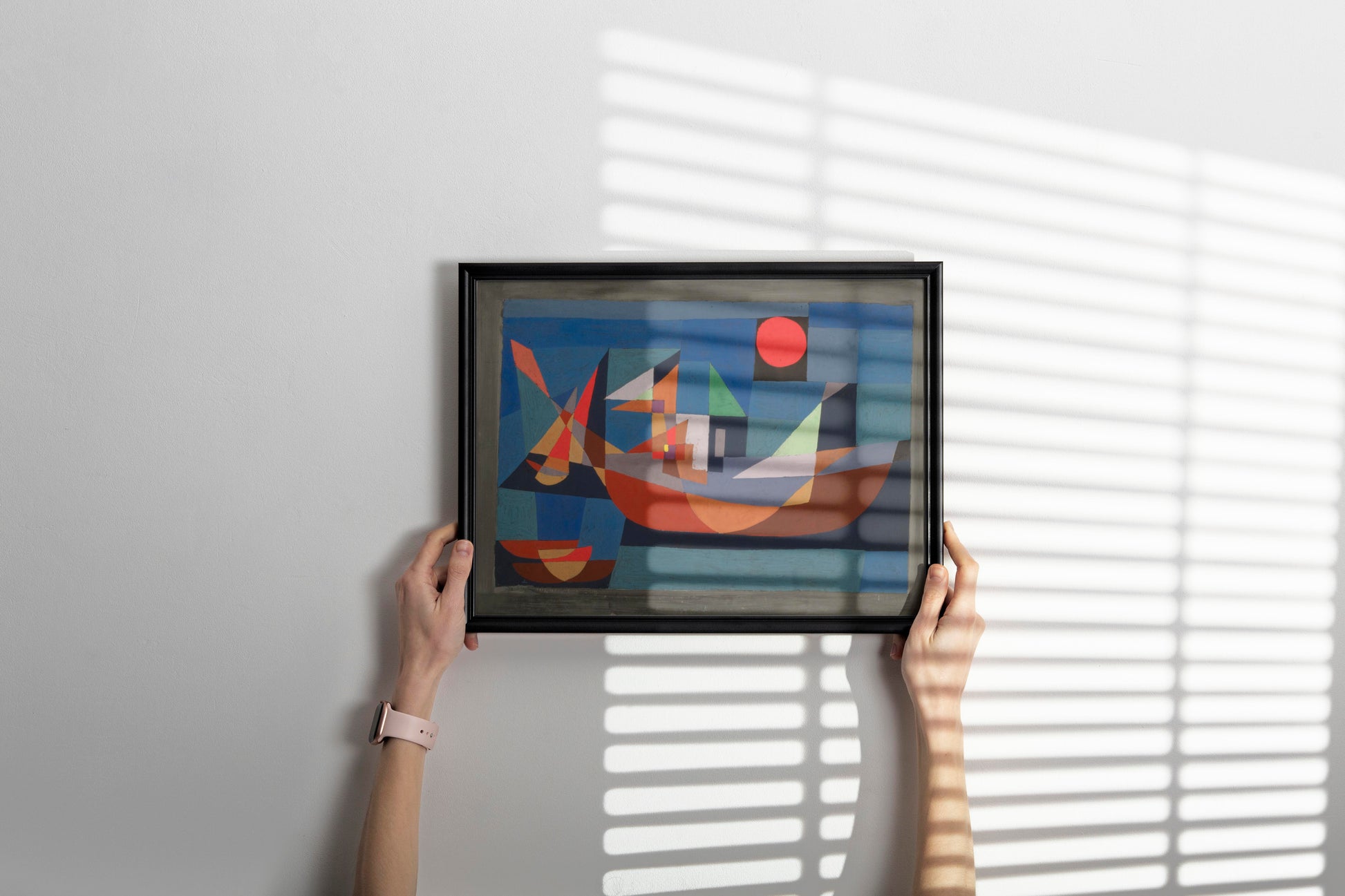 Paul Klee Resting Ships framed art print displayed on living room wall - modernist geometric boat painting in black frame, contemporary home decor
