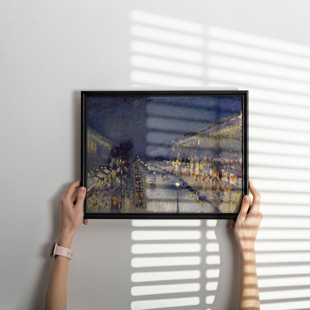 Framed museum quality Pissarro Paris night scene art print hanging on wall, classic French impressionist painting reproduction ideal for gallery wall arrangements and contemporary interior styling