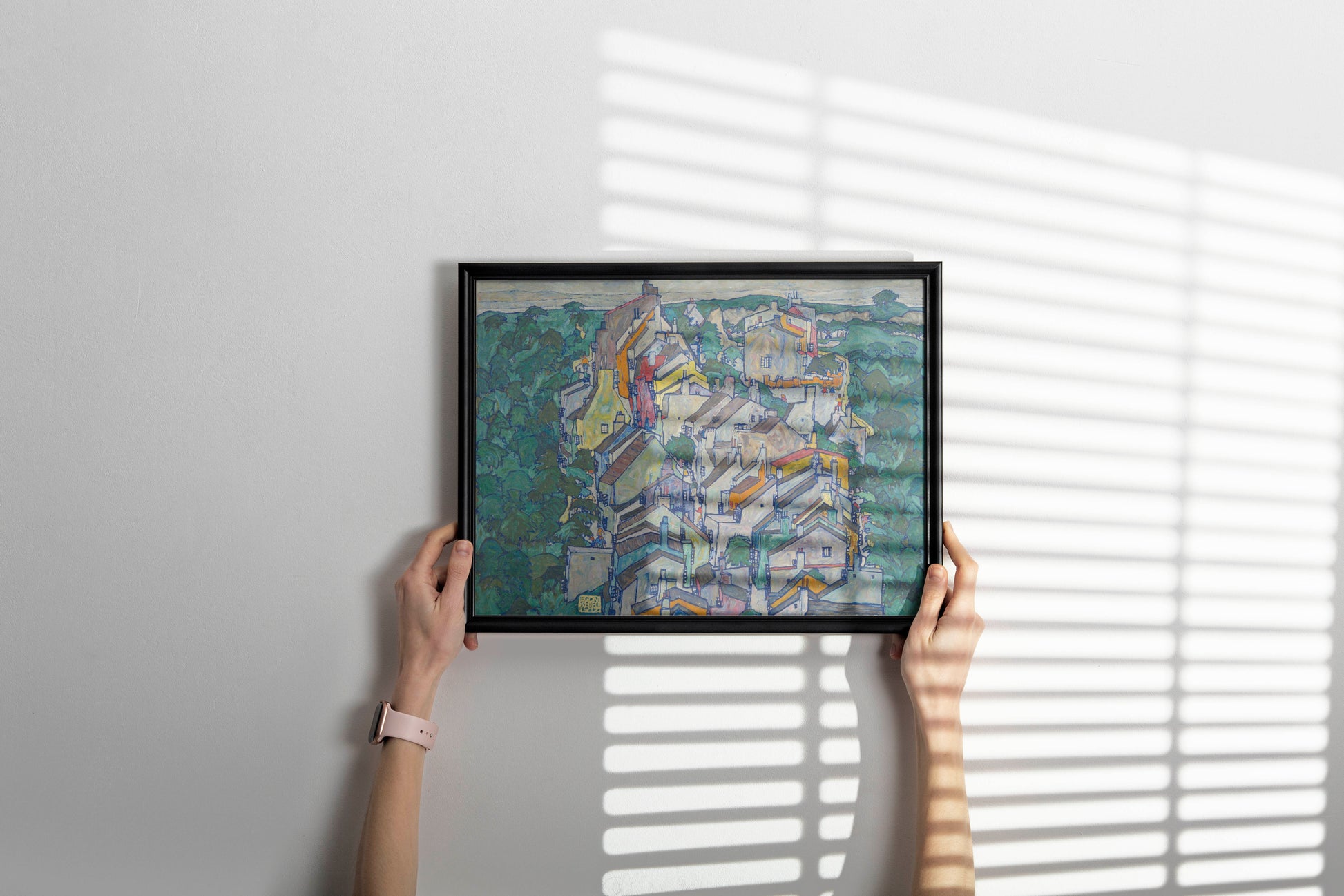 Framed Egon Schiele The Old City III fine art print hanging on living room wall featuring expressionist architecture and vibrant rooftops - gallery quality framed wall art